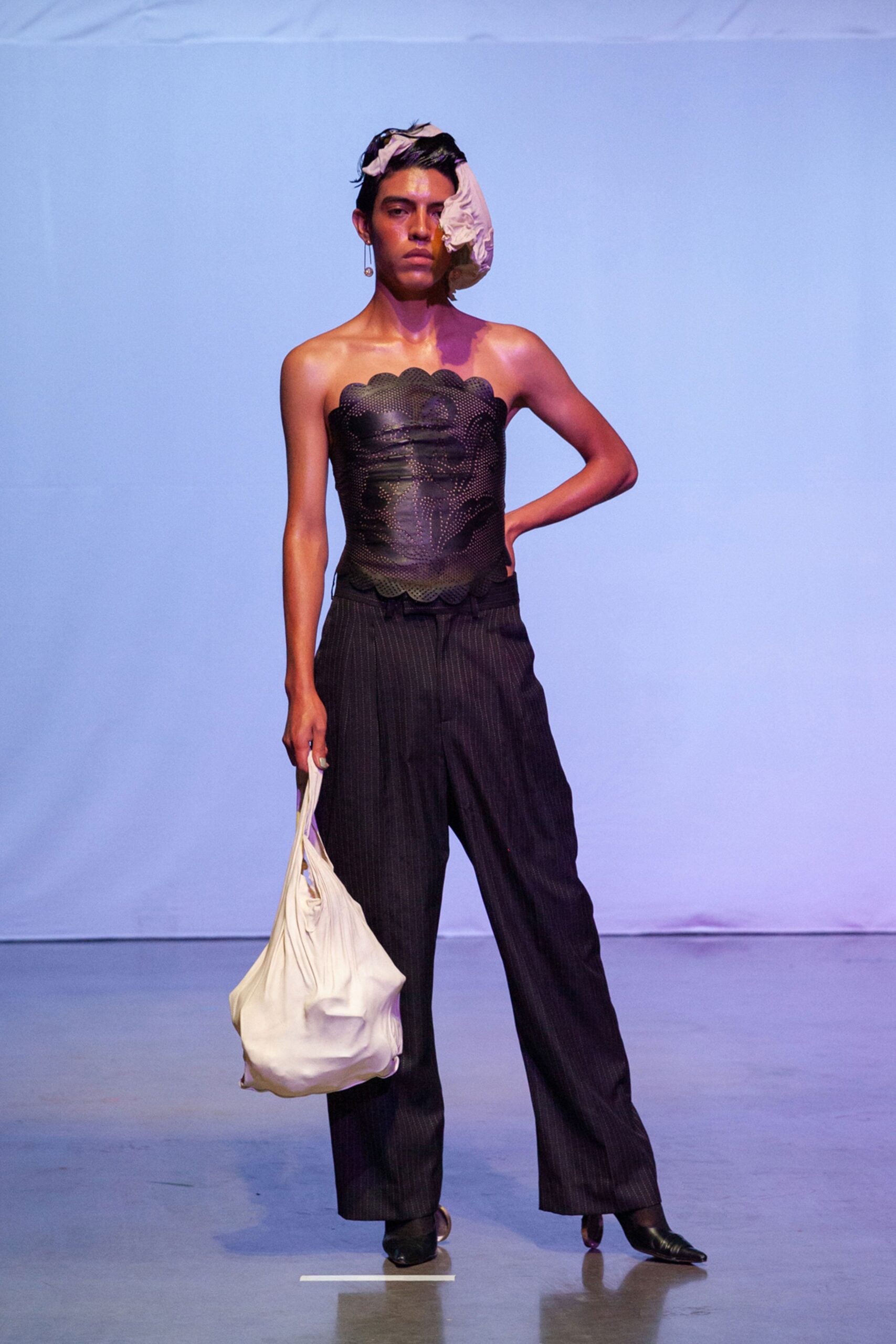 black silk corset and tailored pants