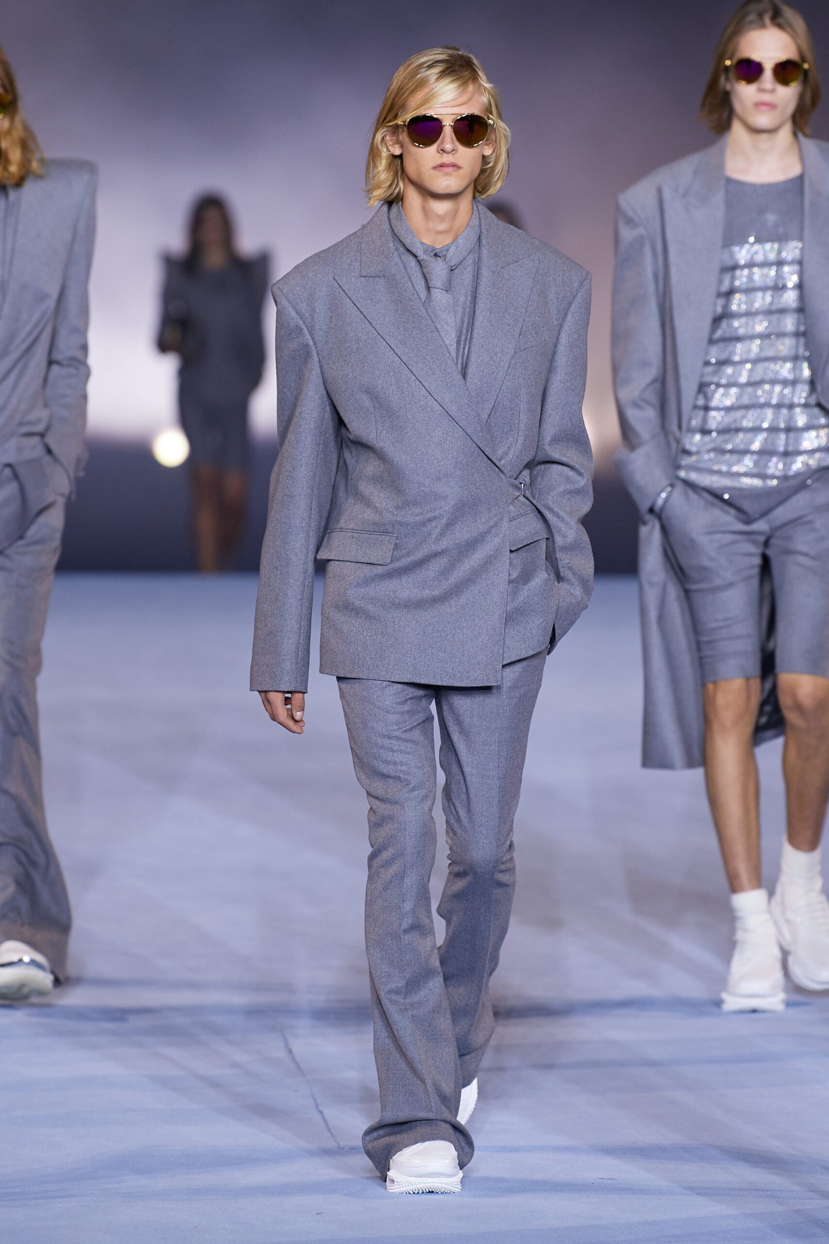 gray tailored suit with sunglasses