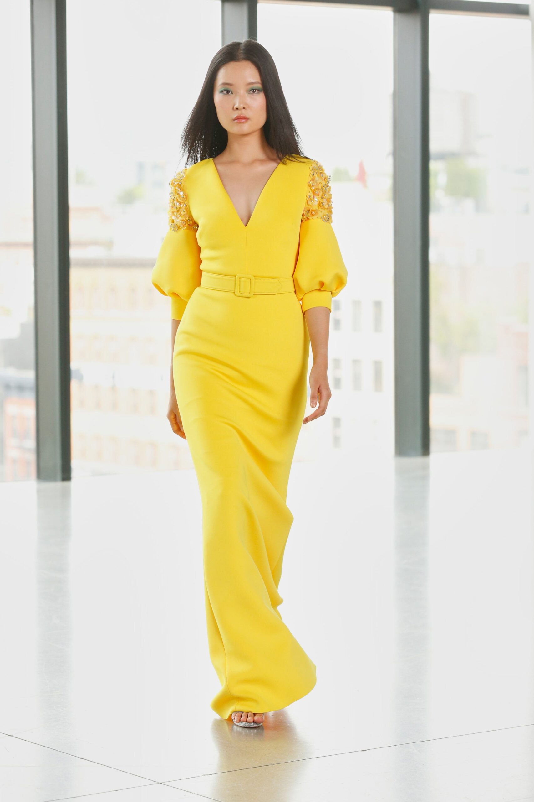 fitted yellow long-sleeve gown