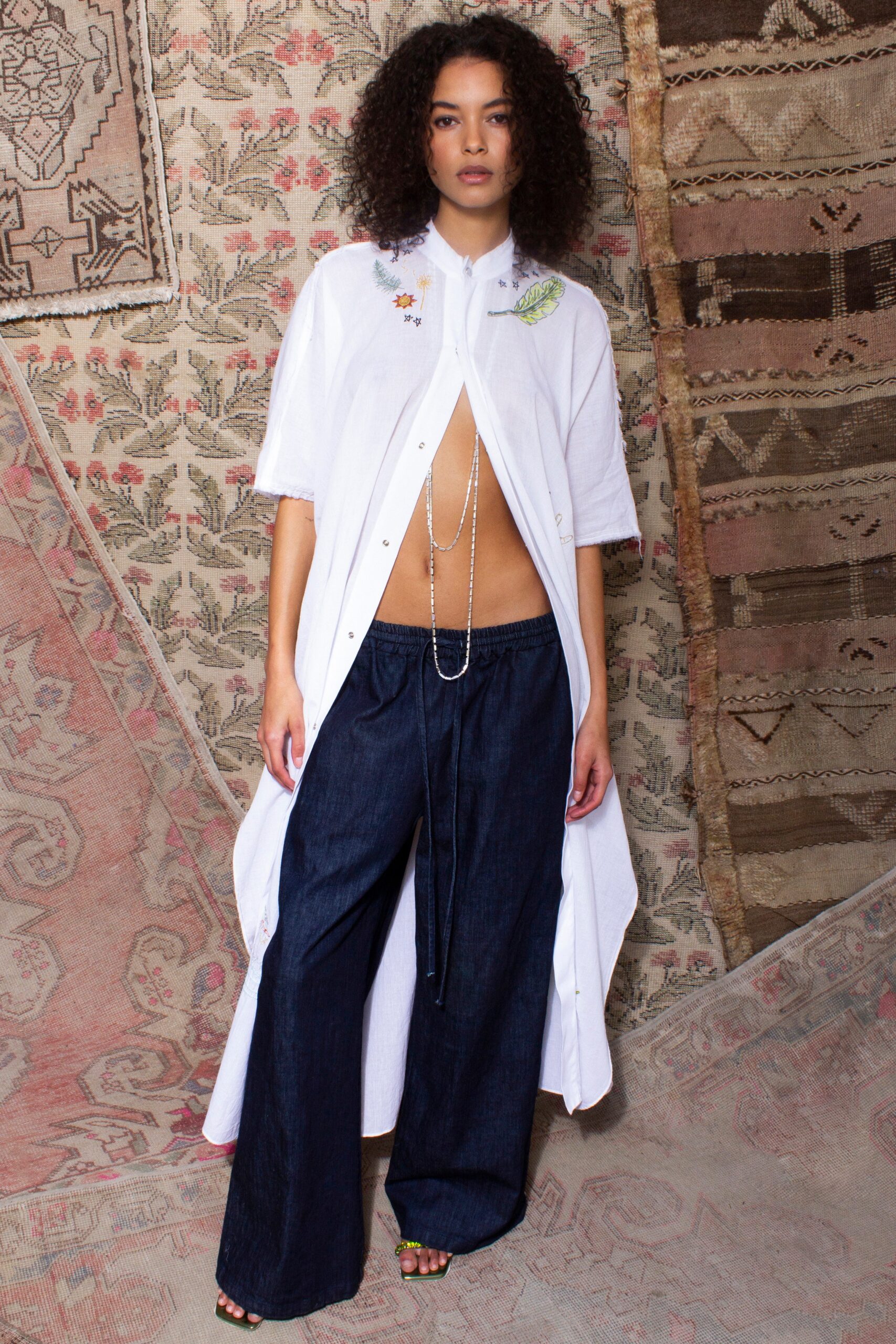 white shirt-dress with blue pants
