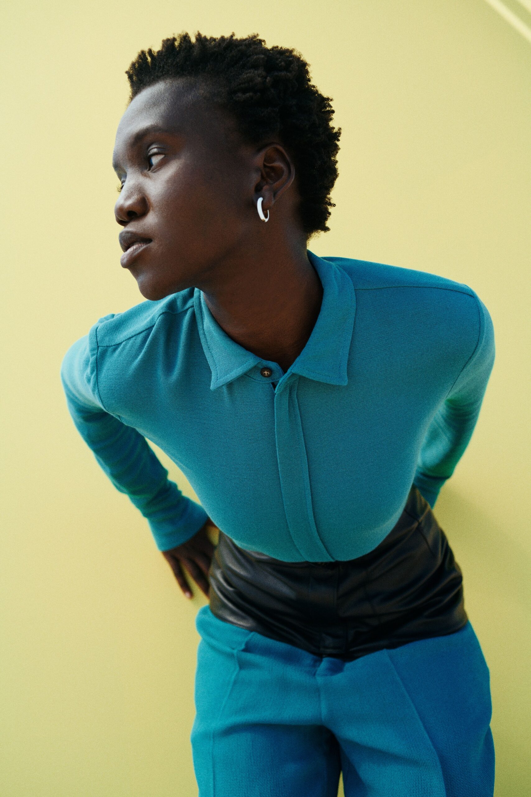 blue fitted top and black leather pants