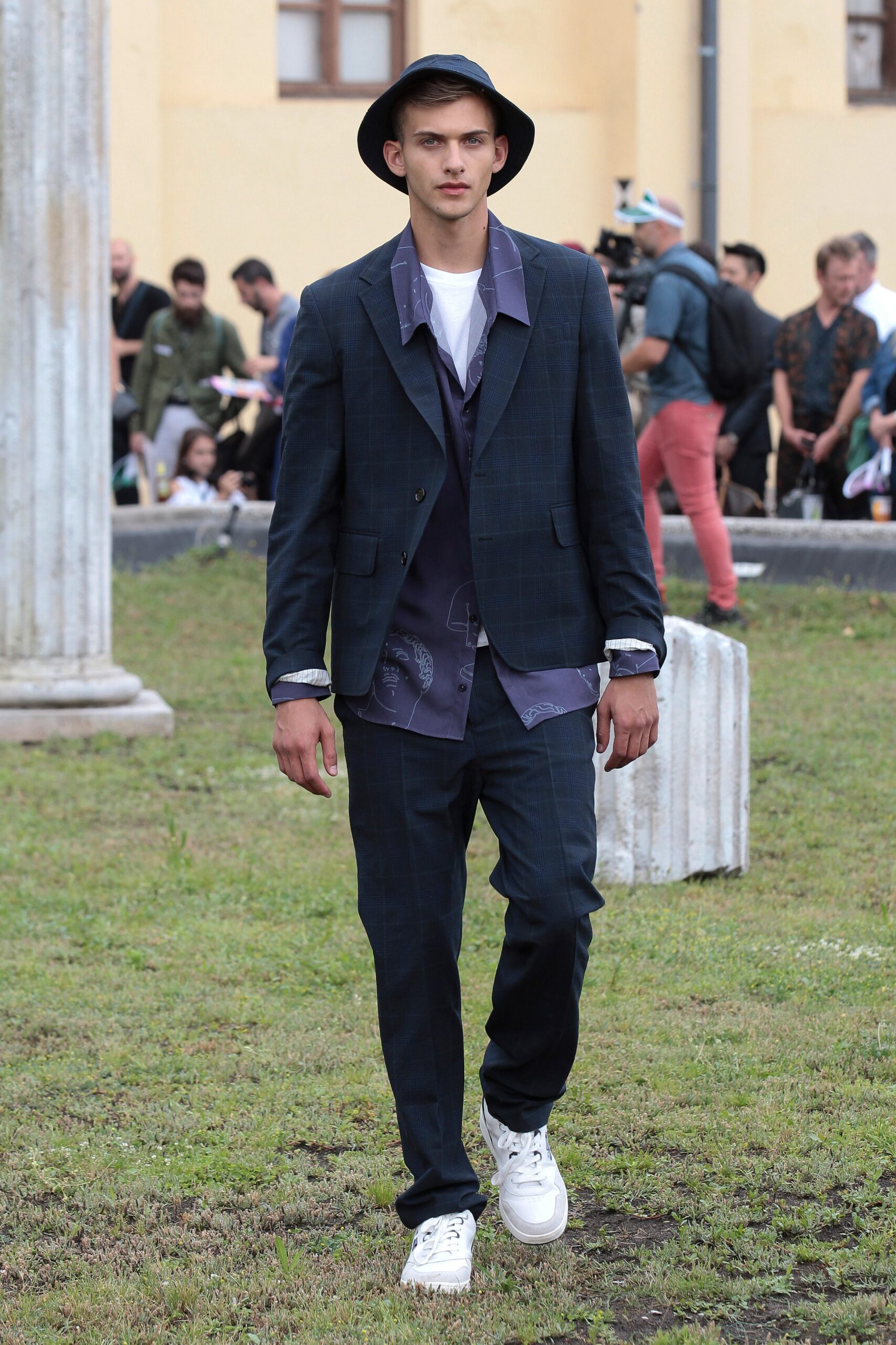 blue tailored suit with purple shirt