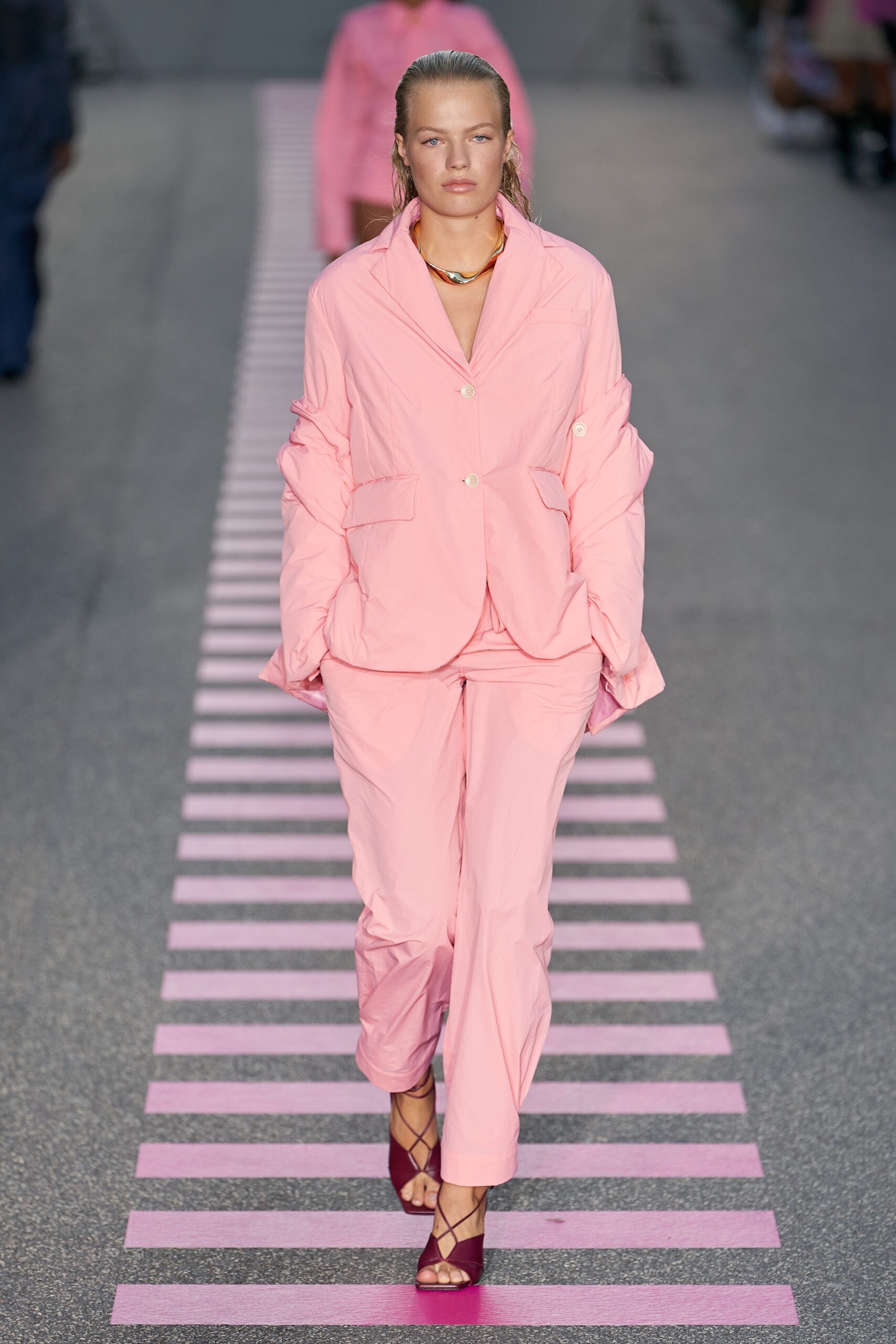pink relaxed suit with purple shoes