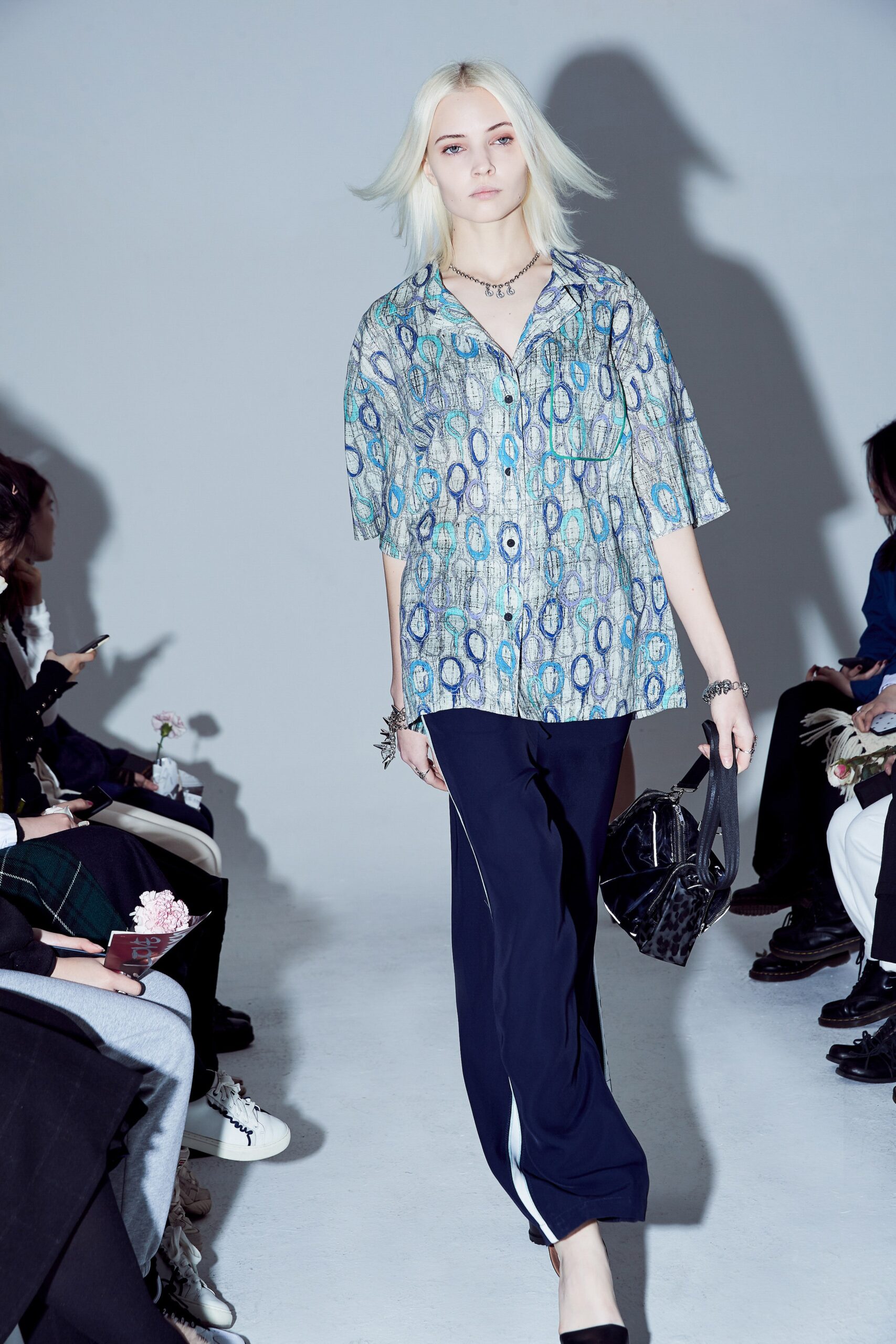 printed silk shirt and black pants