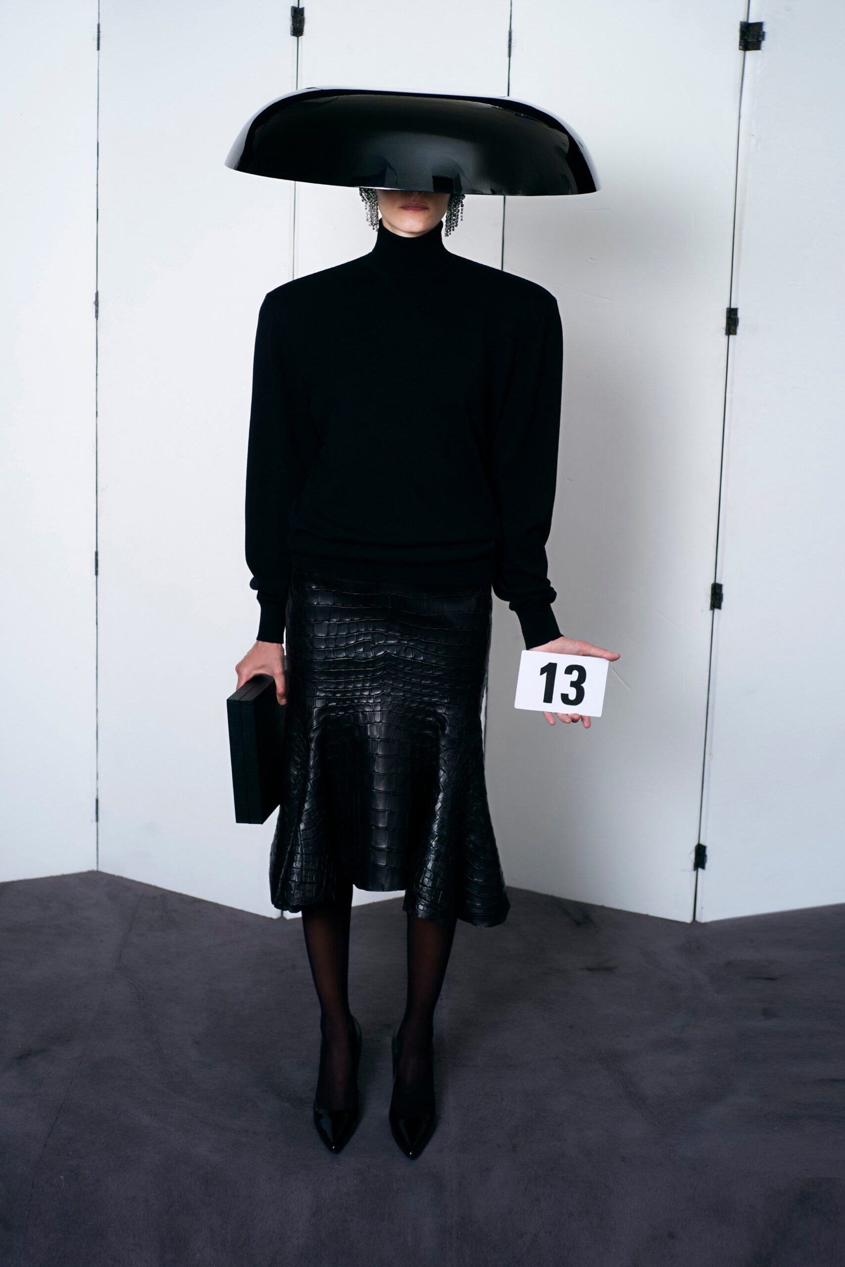black fitted top and flared skirt