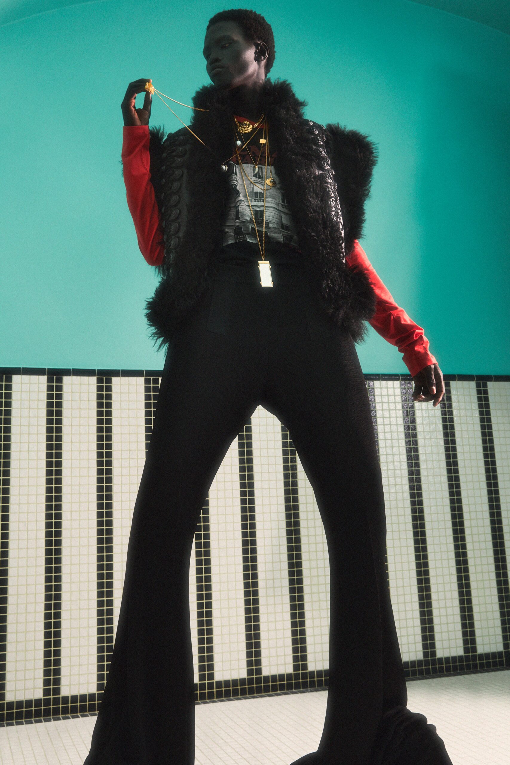 black faux-fur vest red top
