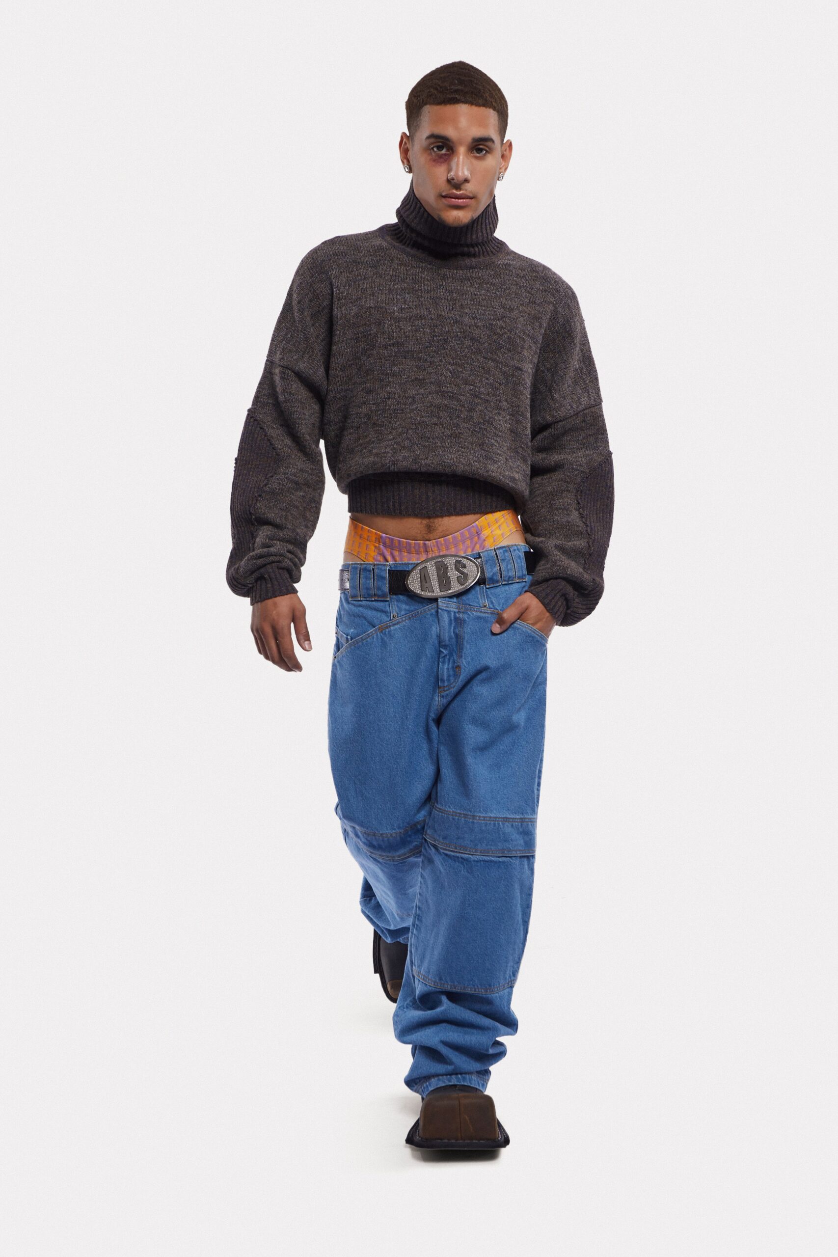 gray wool relaxed sweater with blue jeans