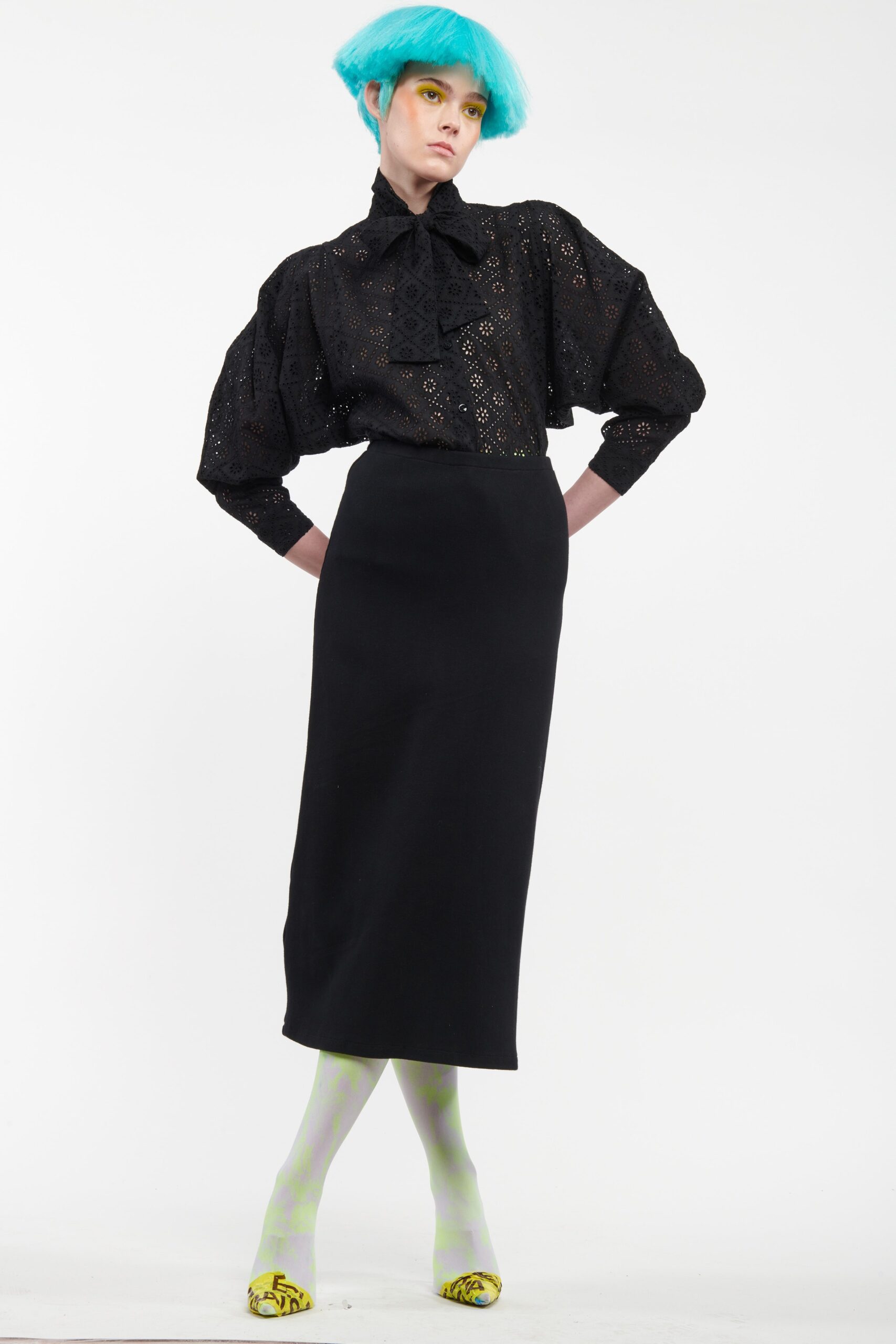 black fitted blouse and midi skirt