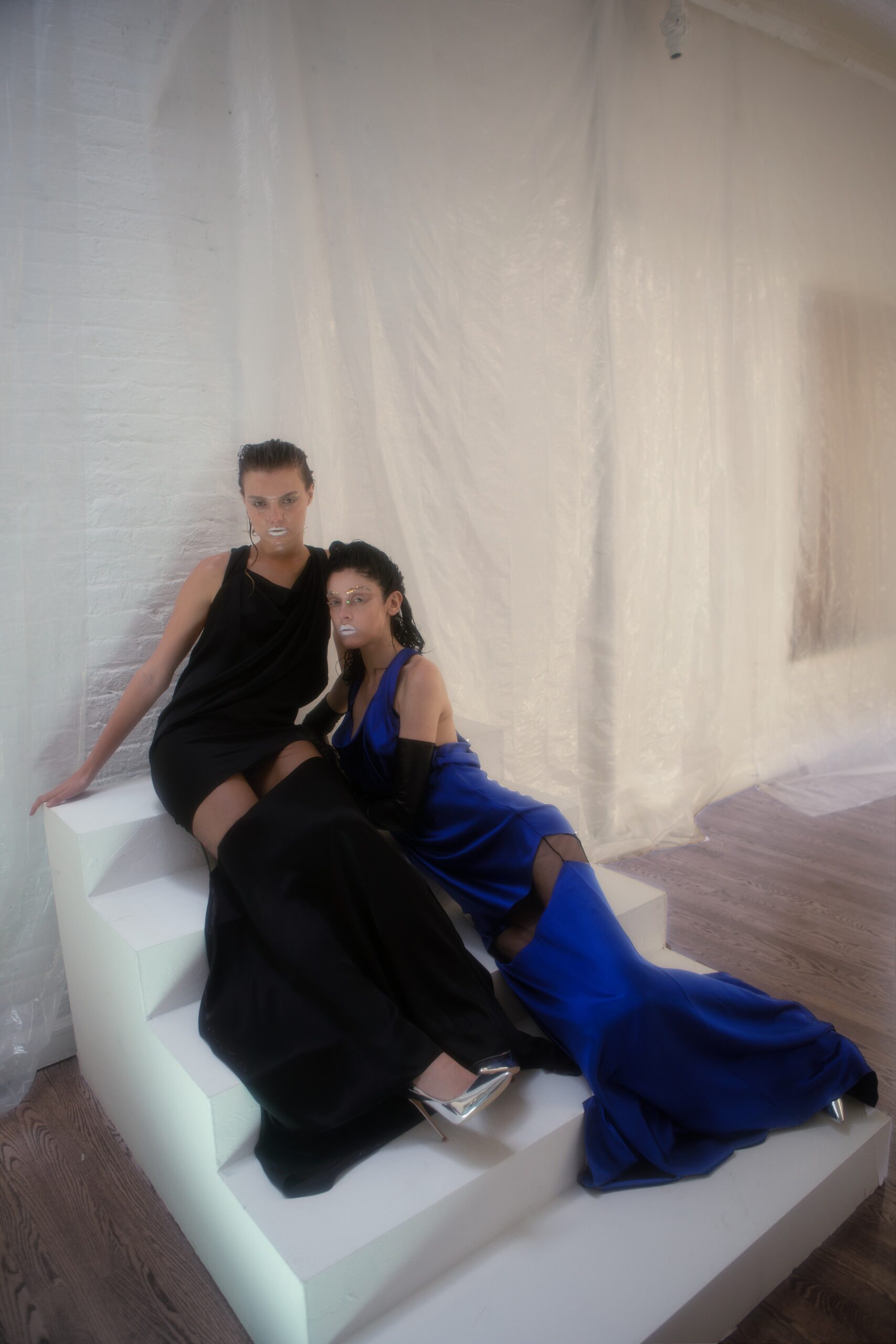 blue silk sleeveless v-neck fitted draped flowing gown