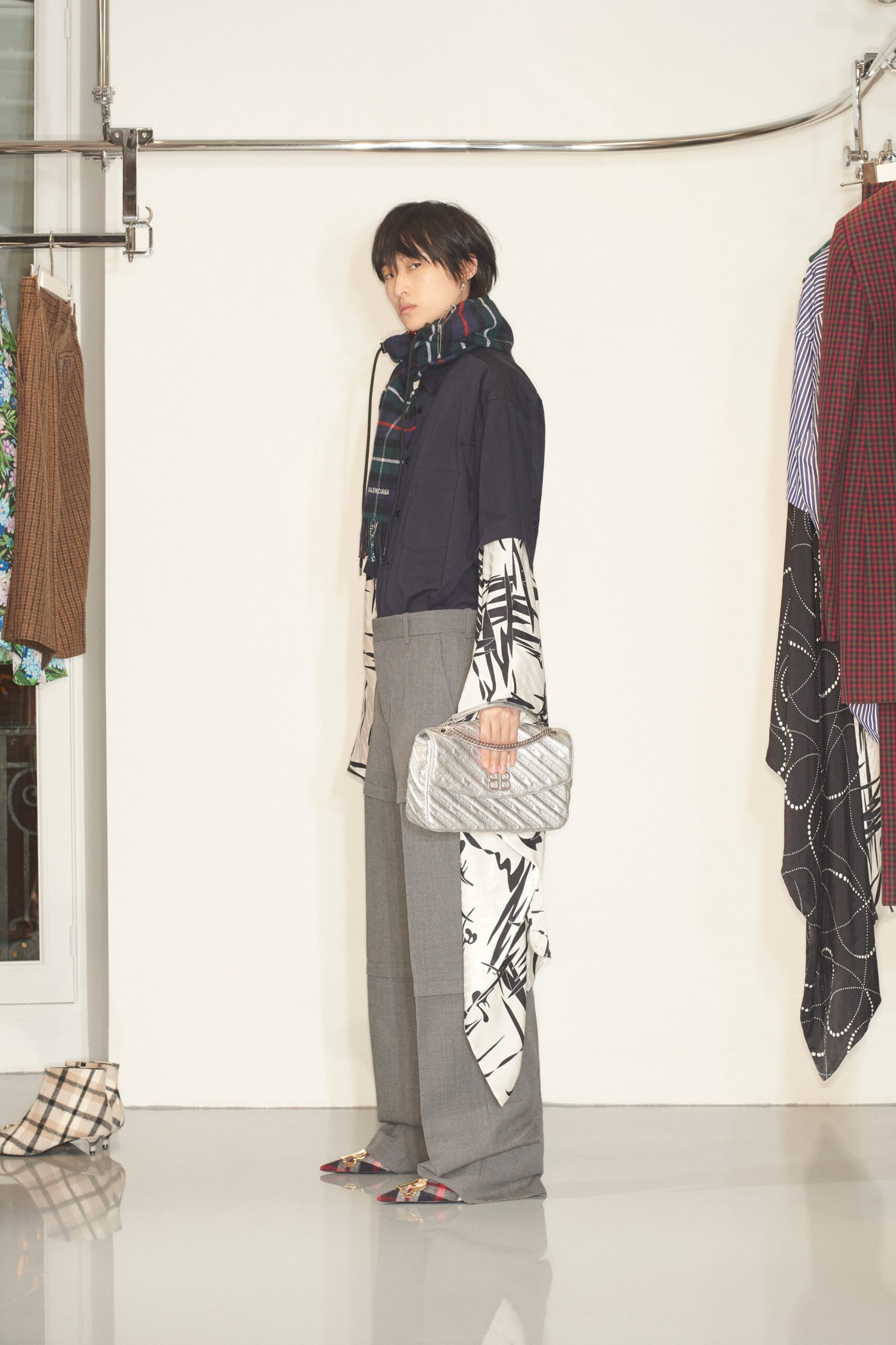 black and white layered jacket with gray pants