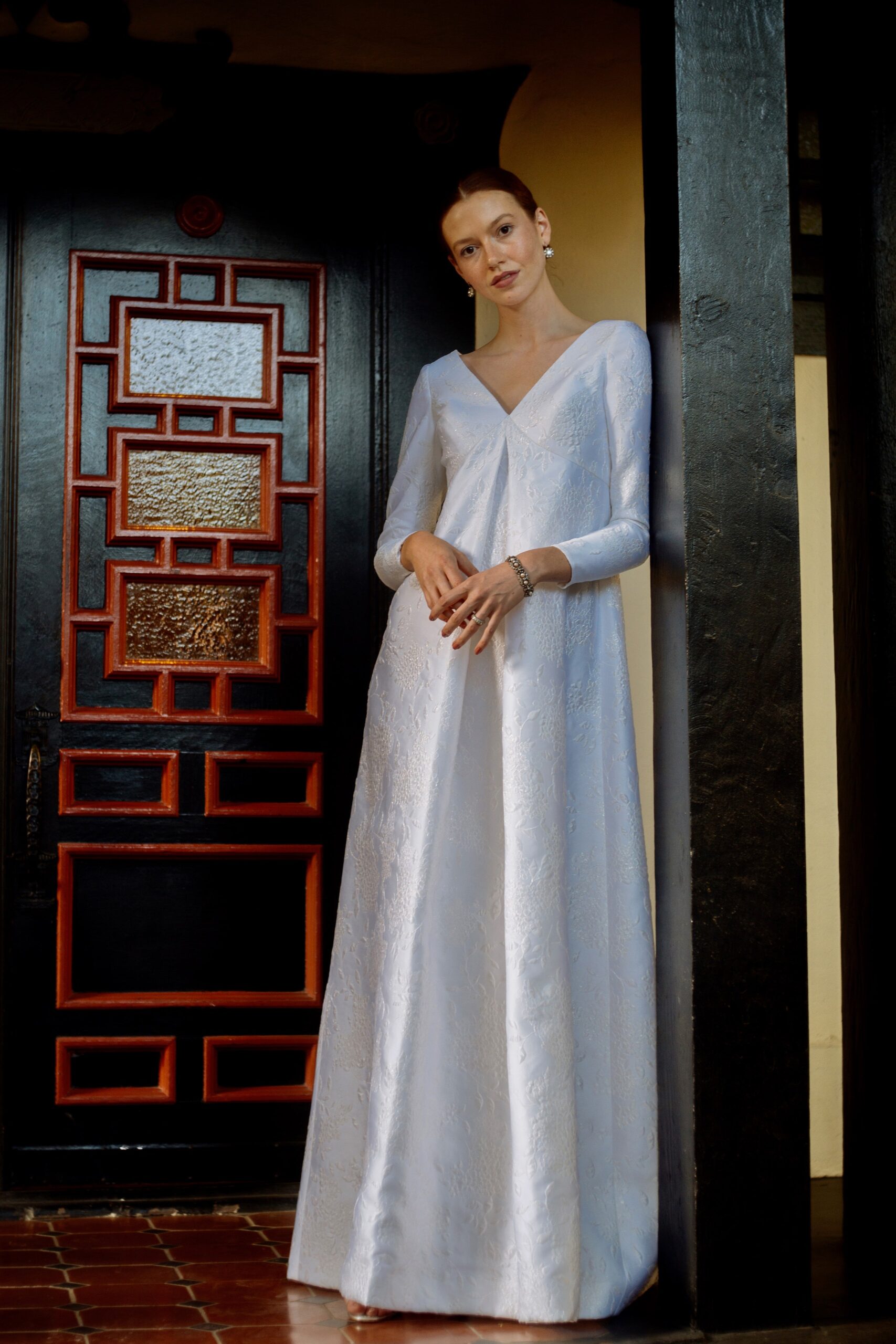 white silk long-sleeve gown