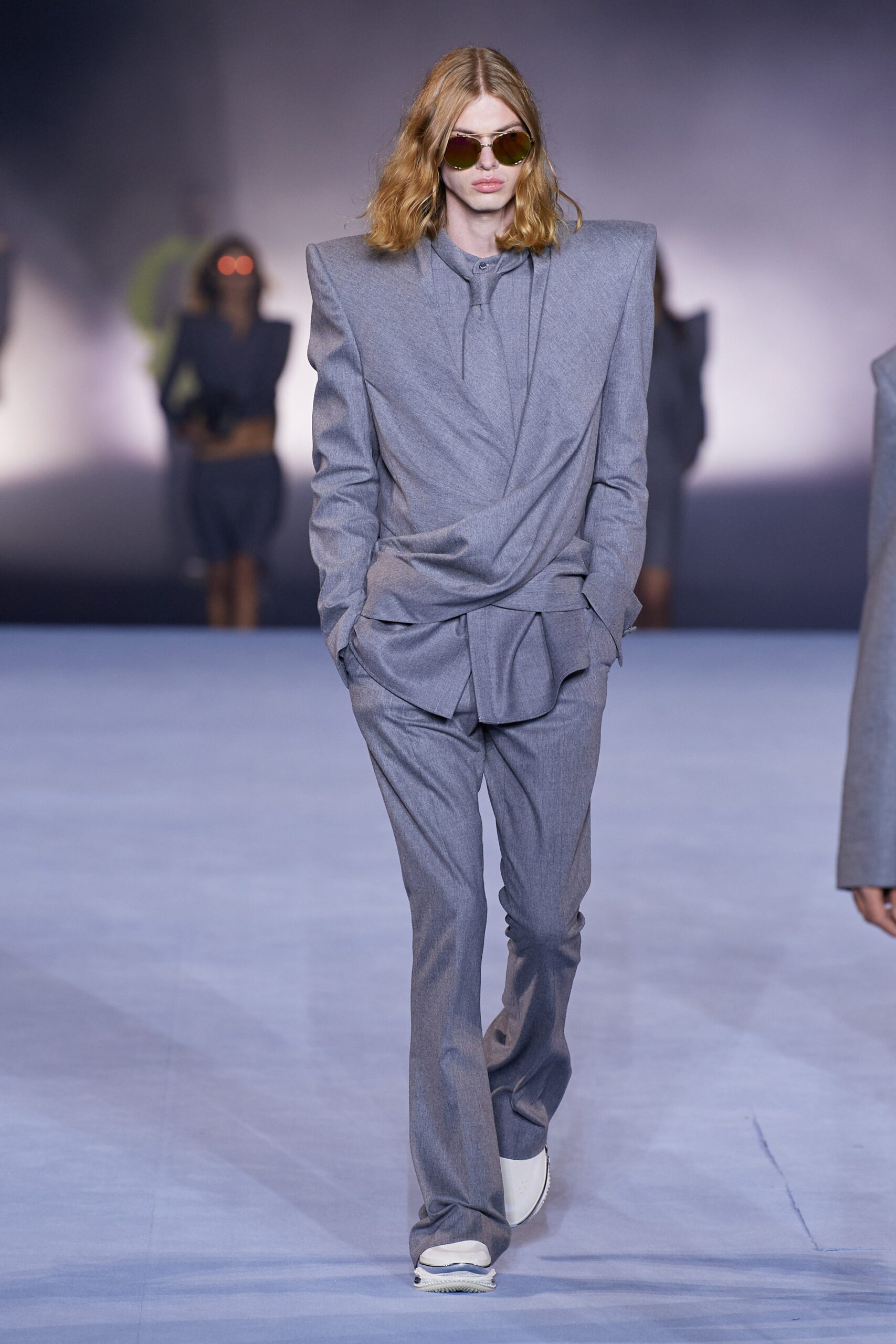 gray tailored suit with sunglasses