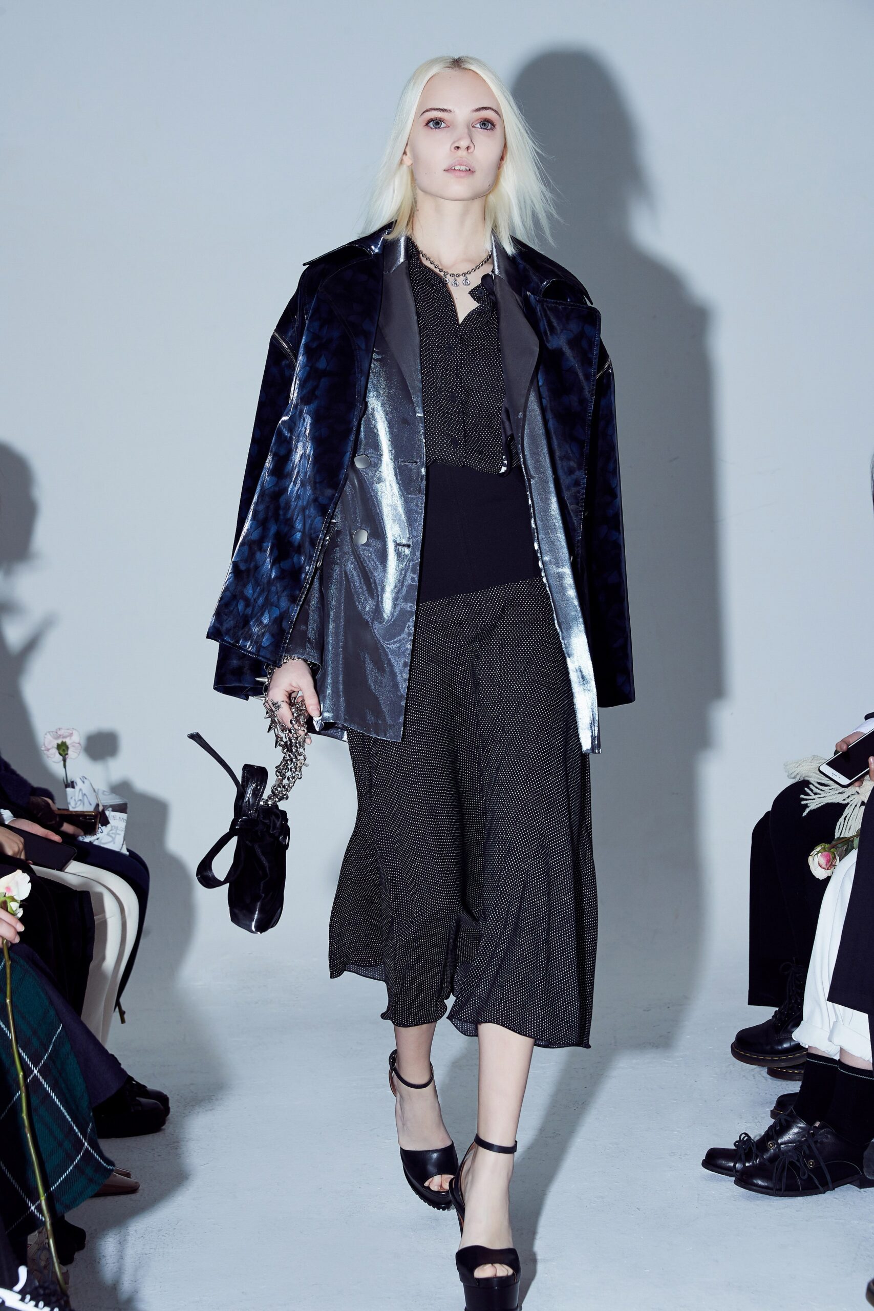 black and blue layered coat with flared dress