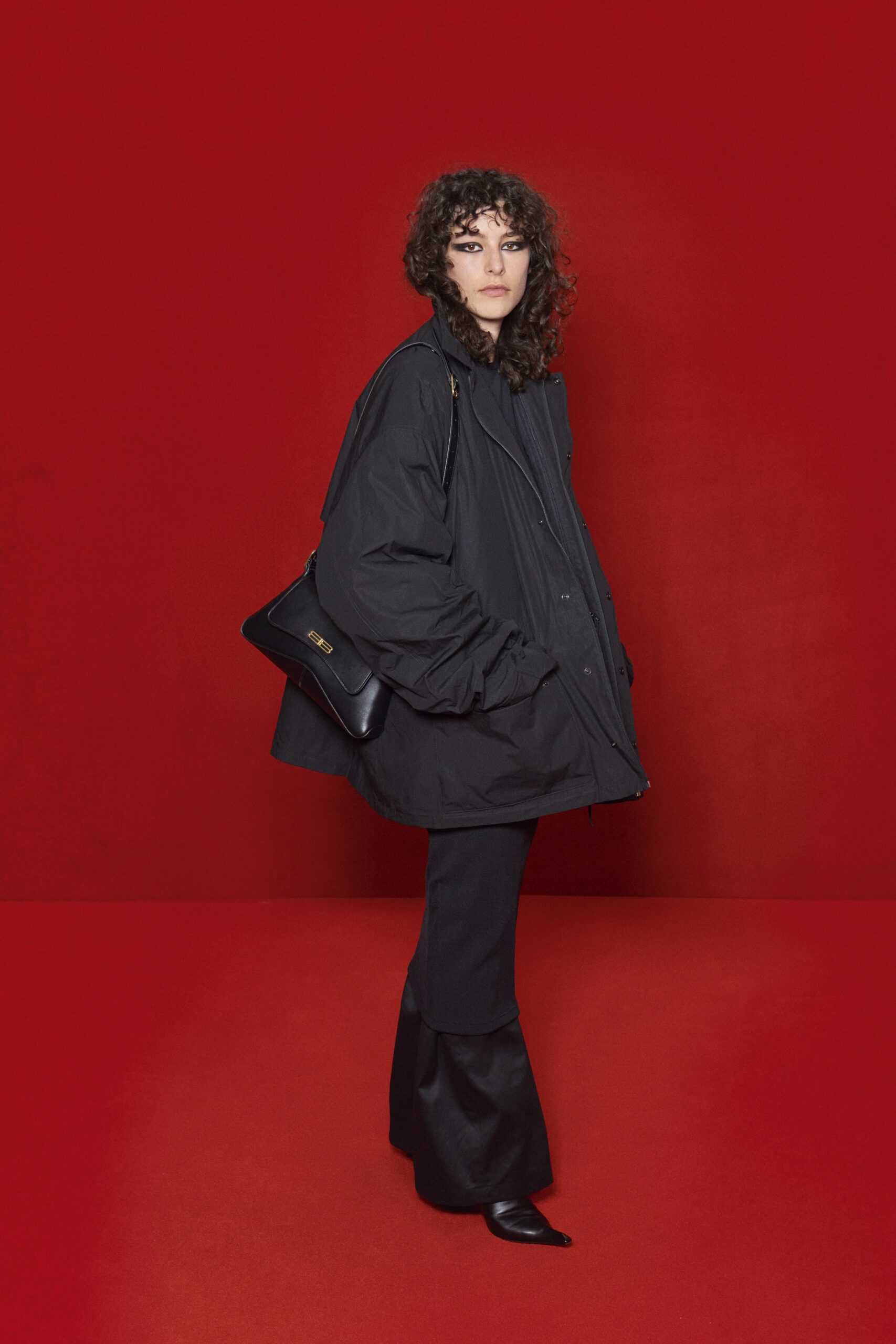 black oversized jacket and flared pants