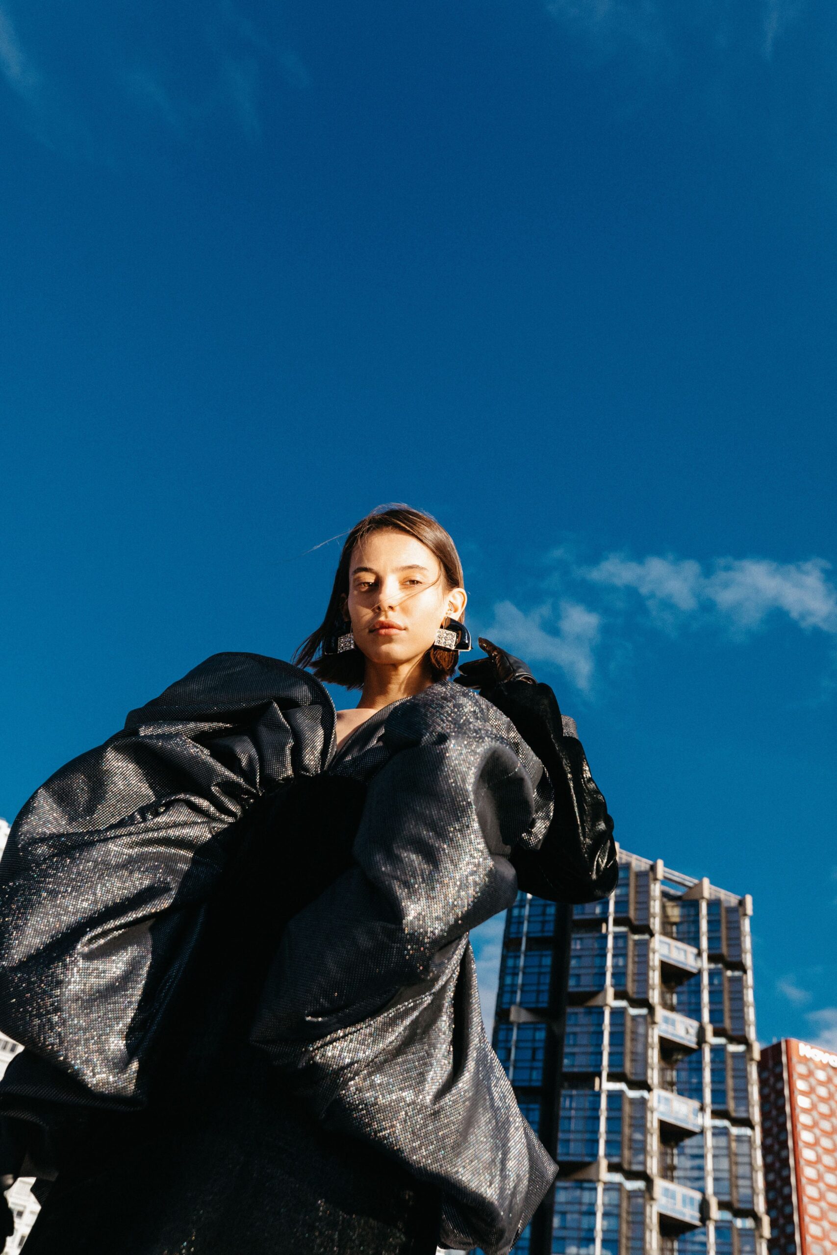 black oversized jacket and fitted dress