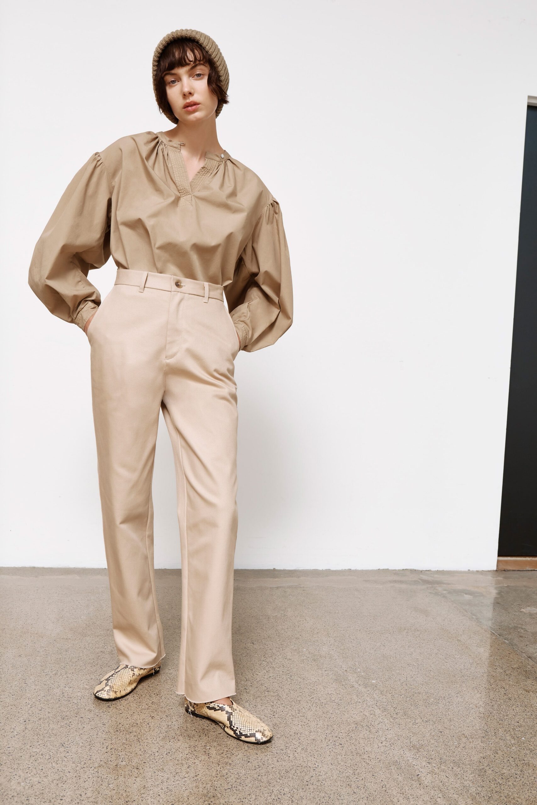 beige relaxed blouse and tailored pants