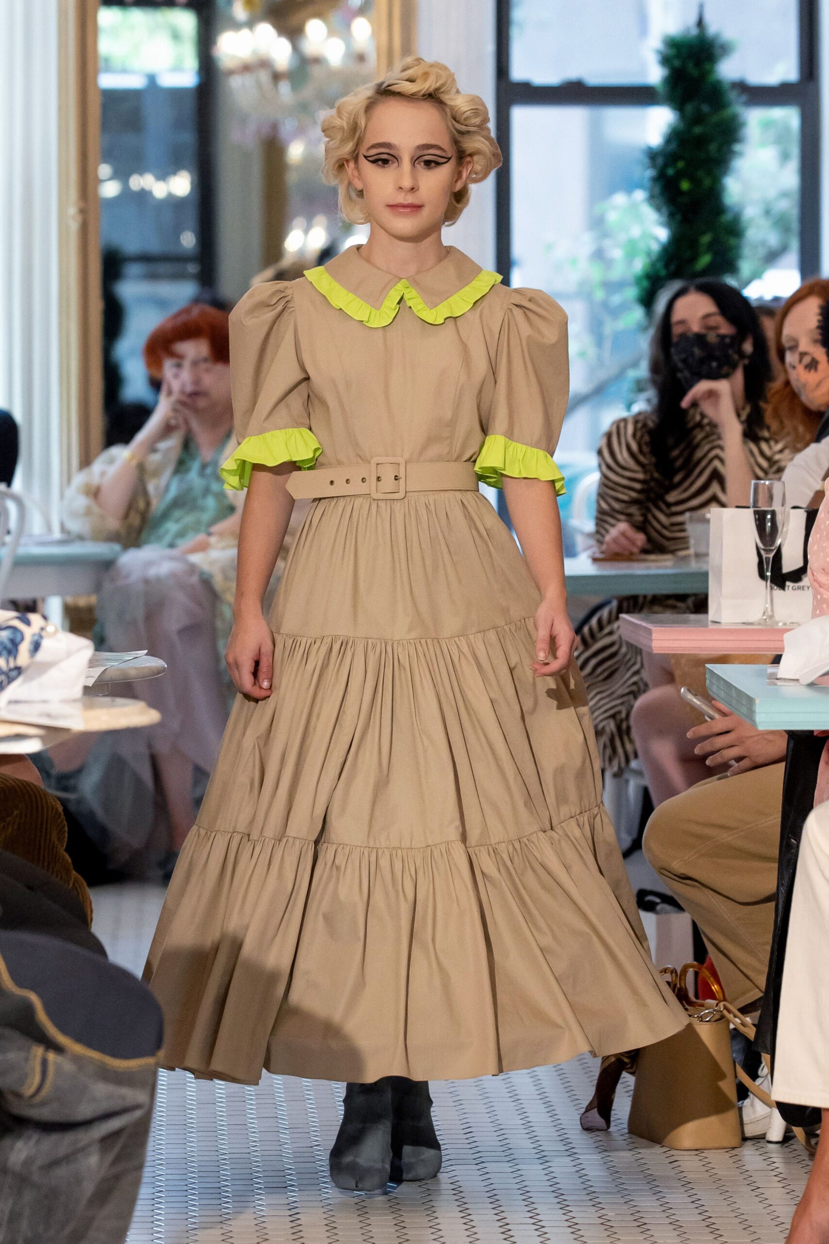 beige tiered dress with green accents