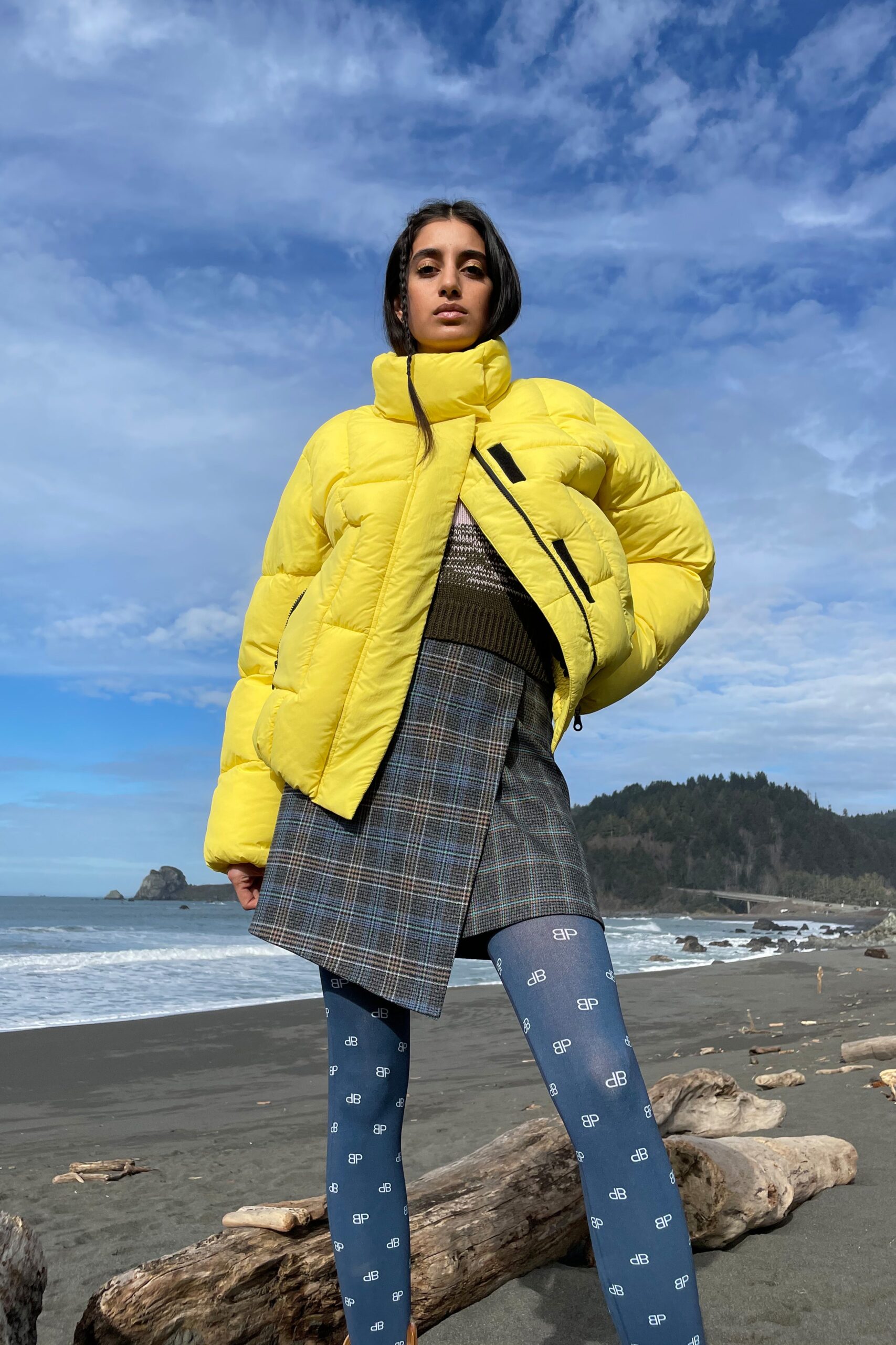 yellow puffer jacket with gray skirt