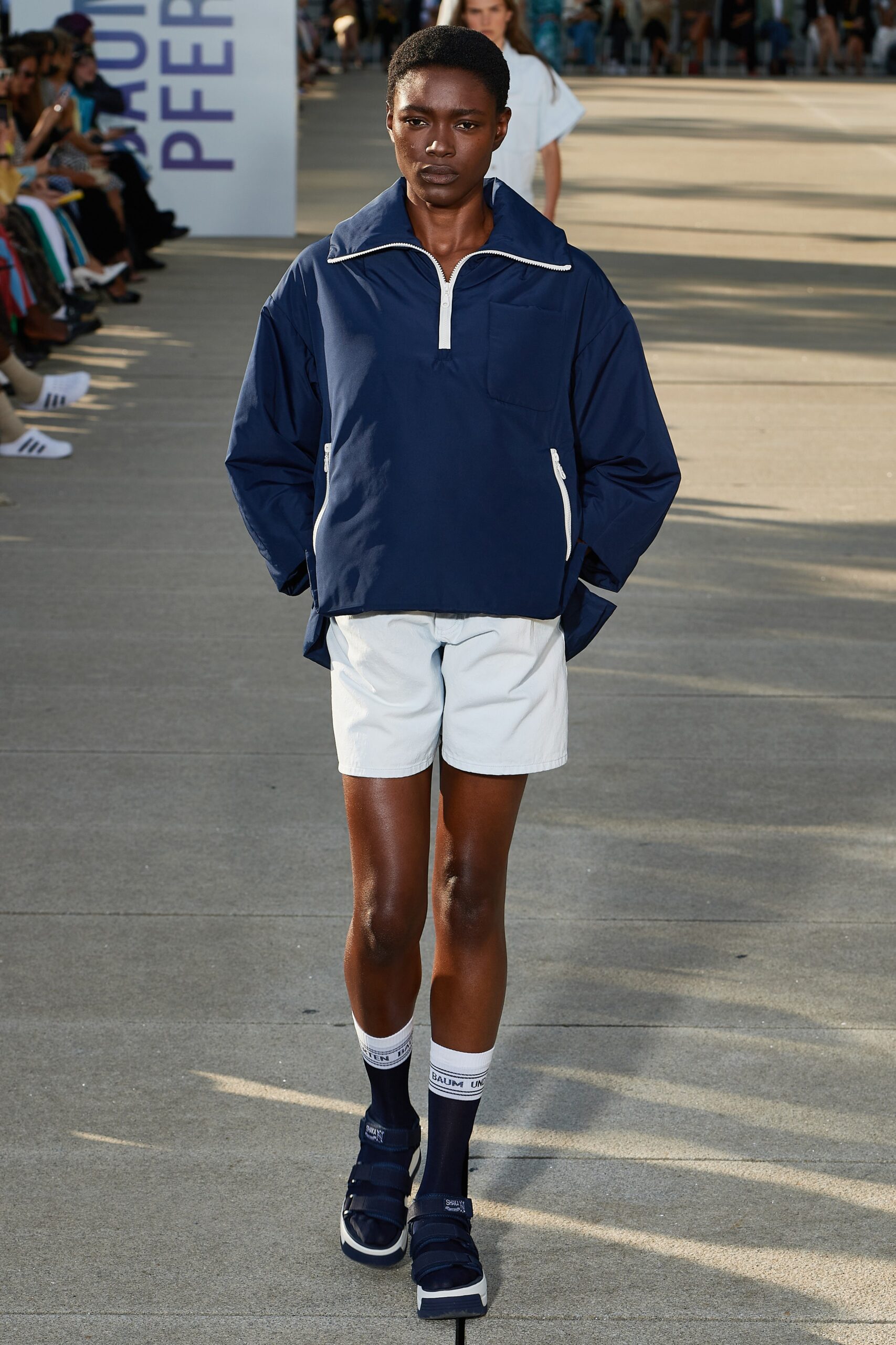 blue relaxed jacket with white shorts