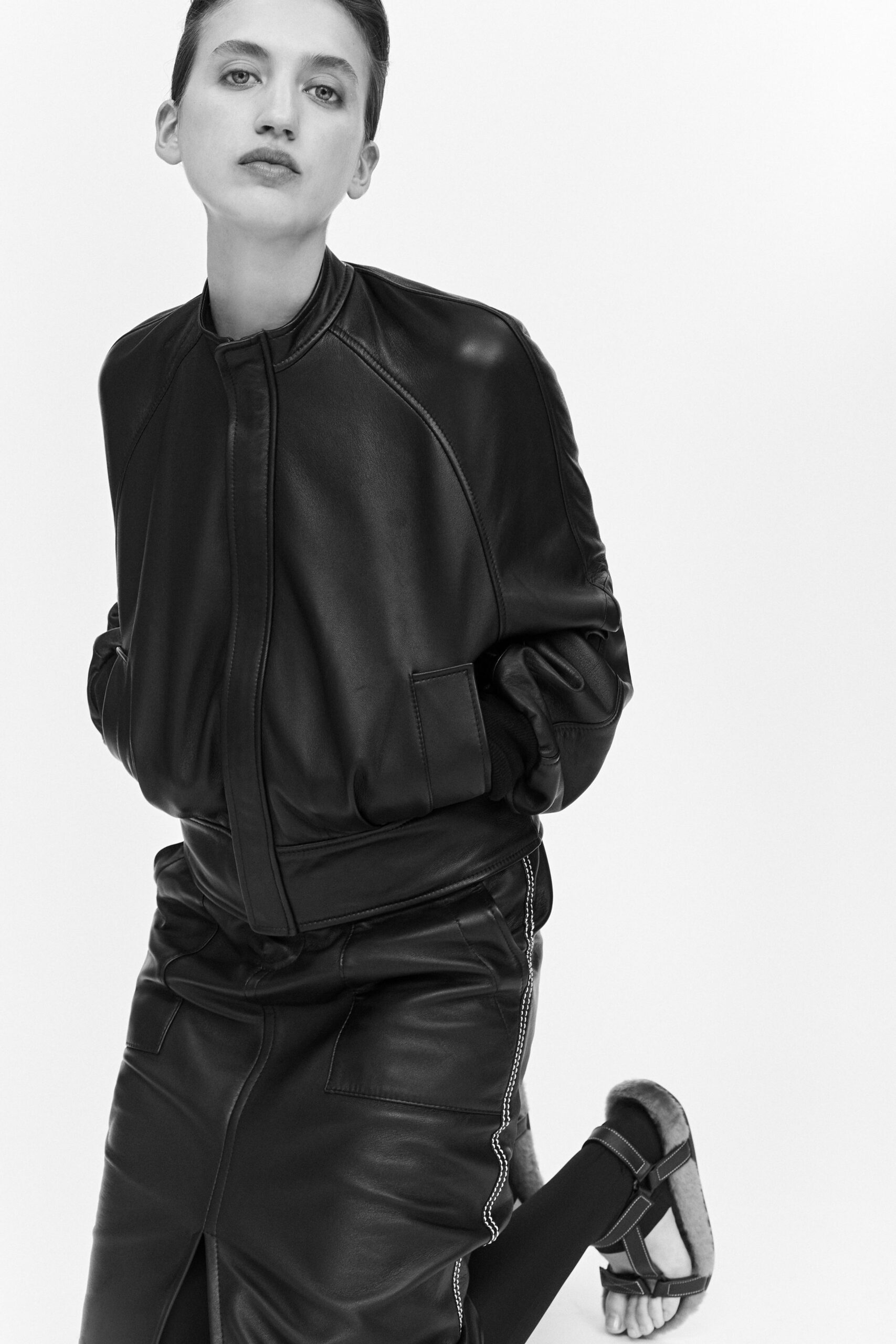 black leather fitted jacket and skirt