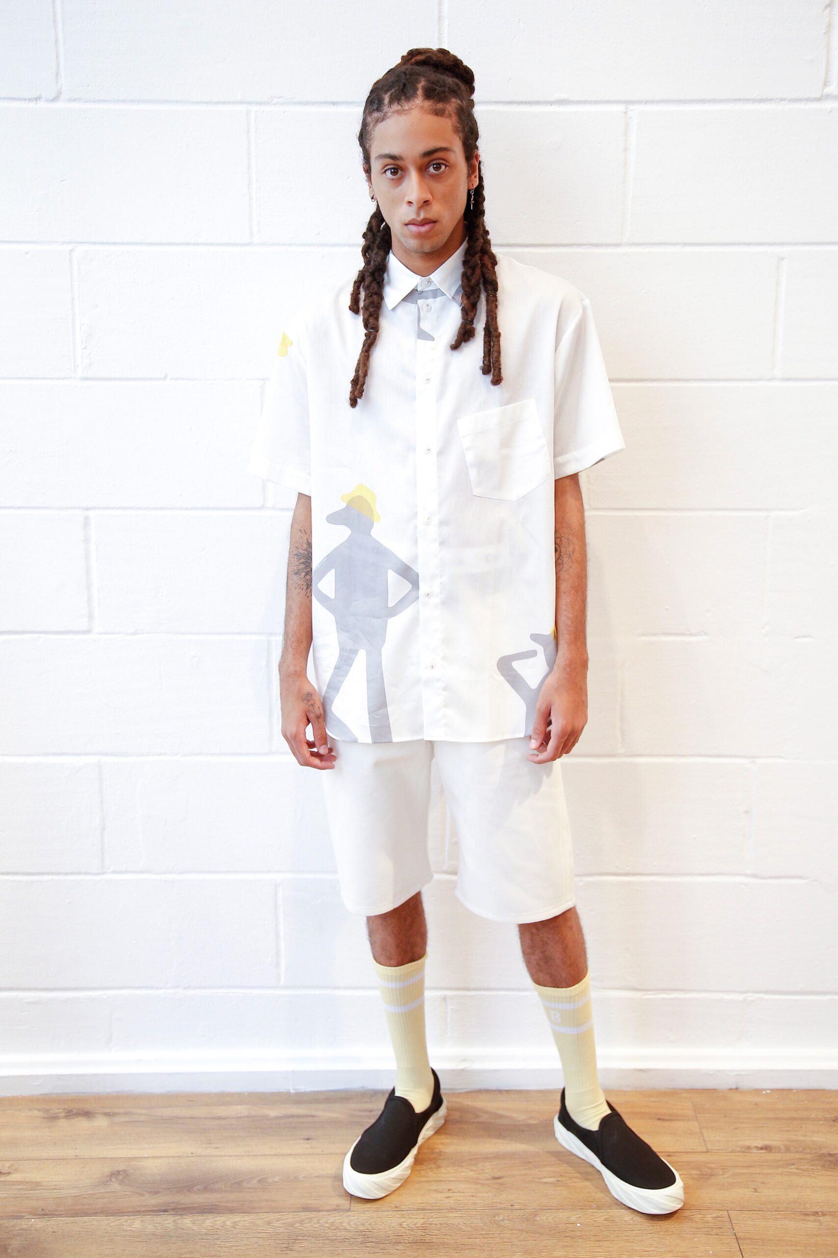 white relaxed shirt and shorts