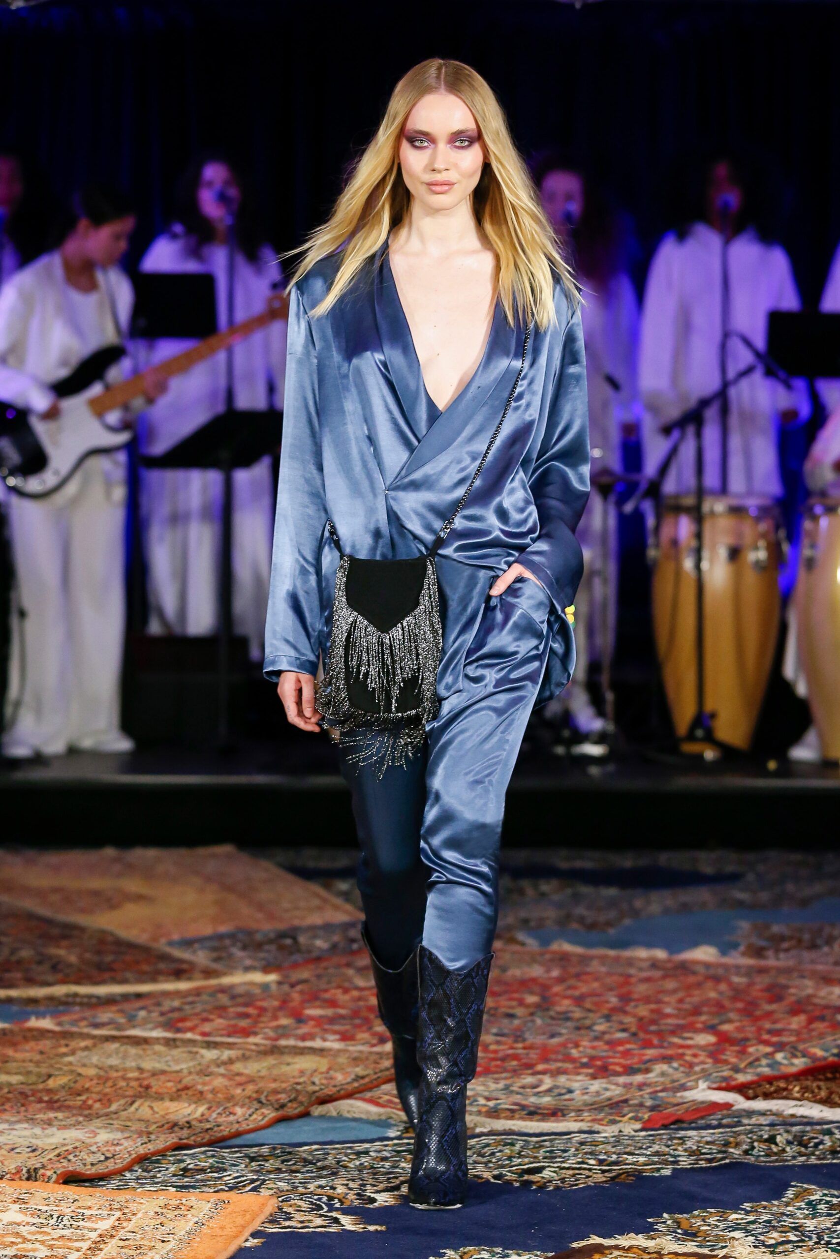 blue silk fitted jumpsuit with fringed belt
