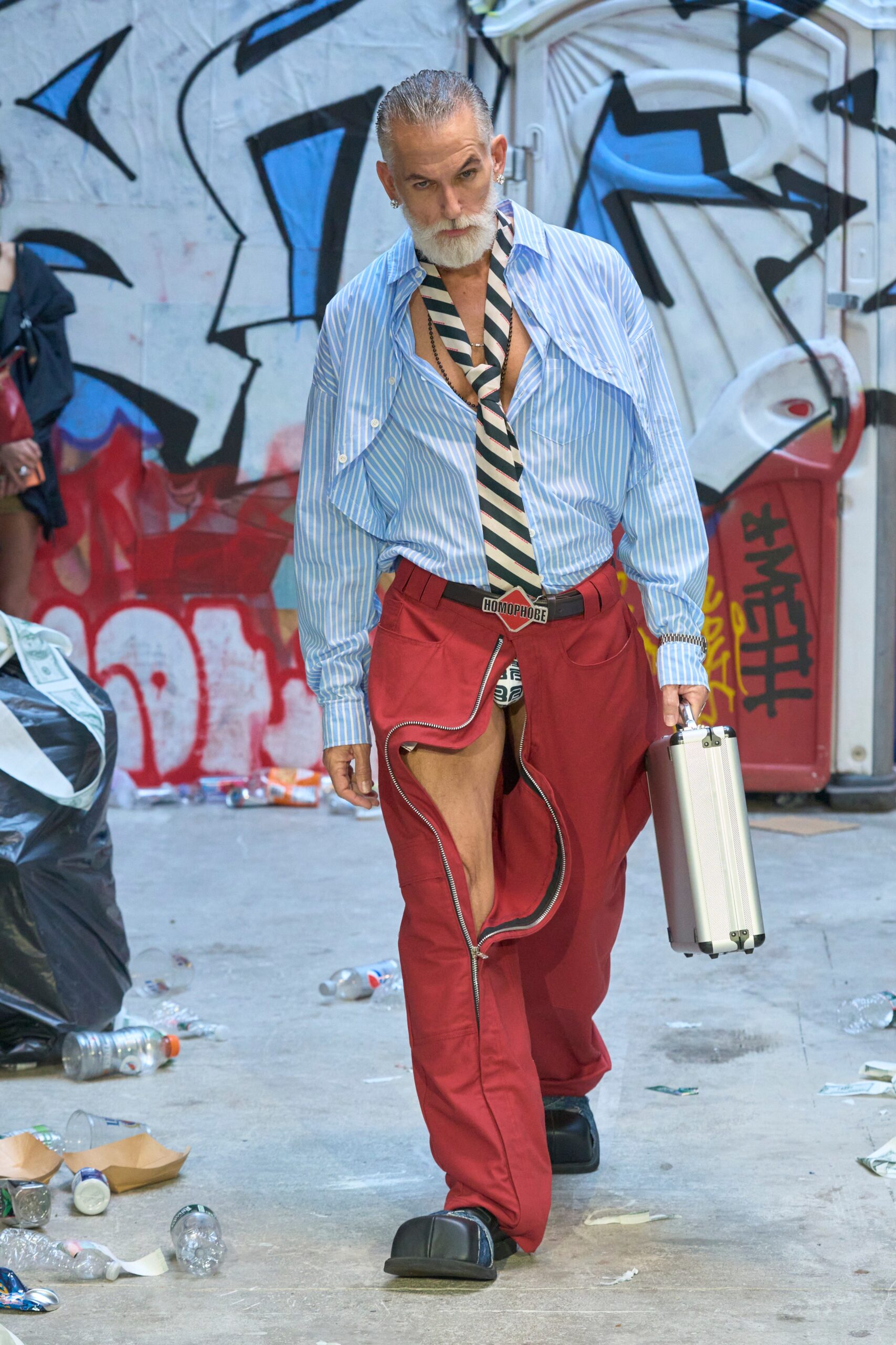 blue striped shirt and red pants