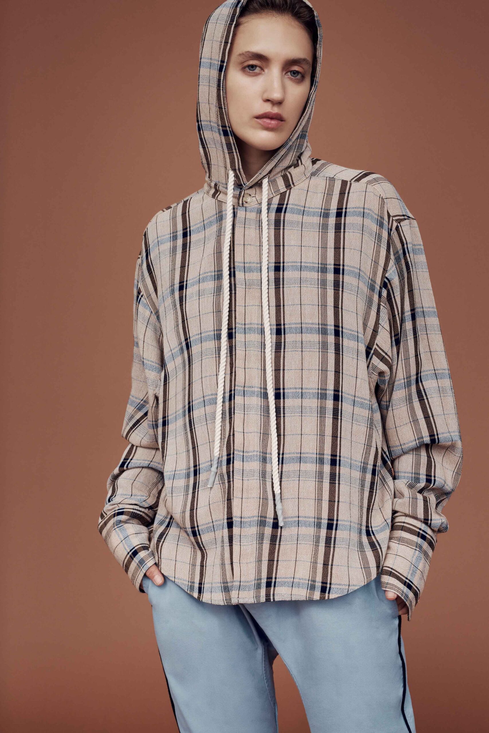 beige checked hoodie with blue pants