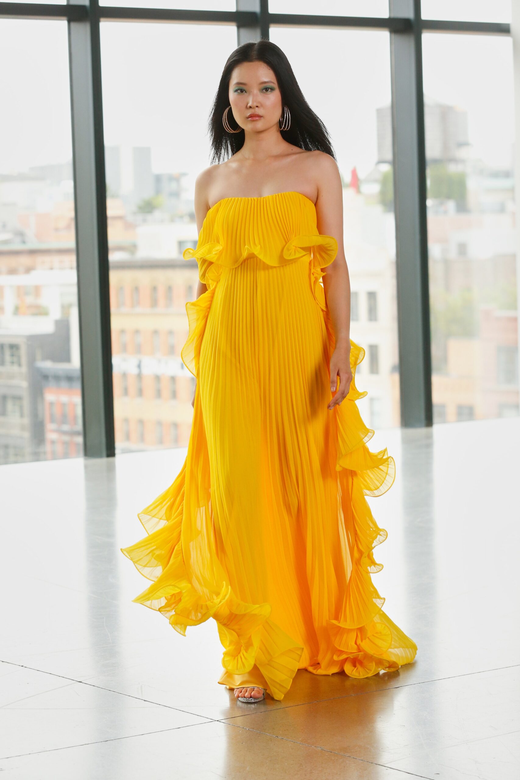 yellow pleated strapless gown
