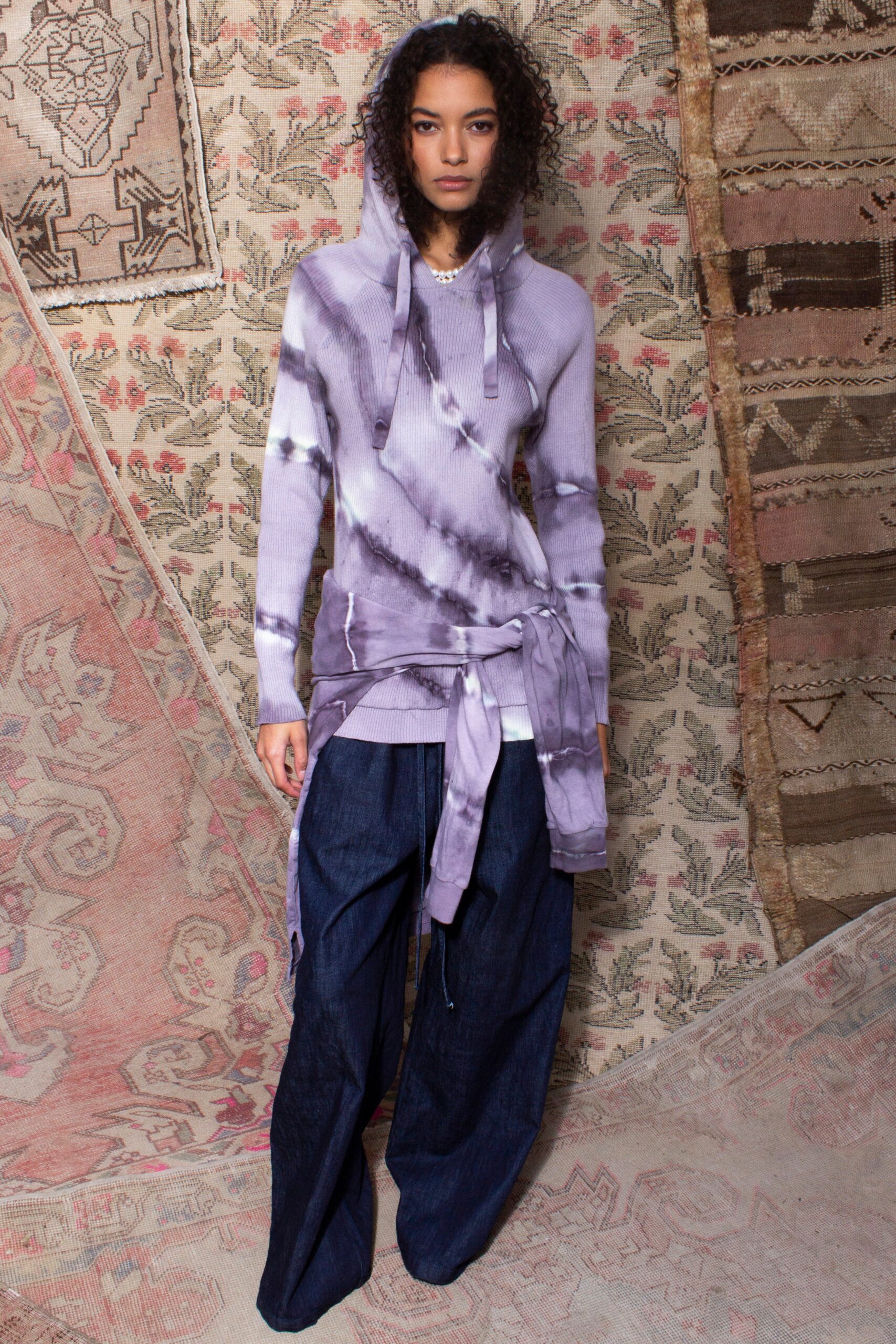 purple tie-dye hoodie and blue wide-leg pants