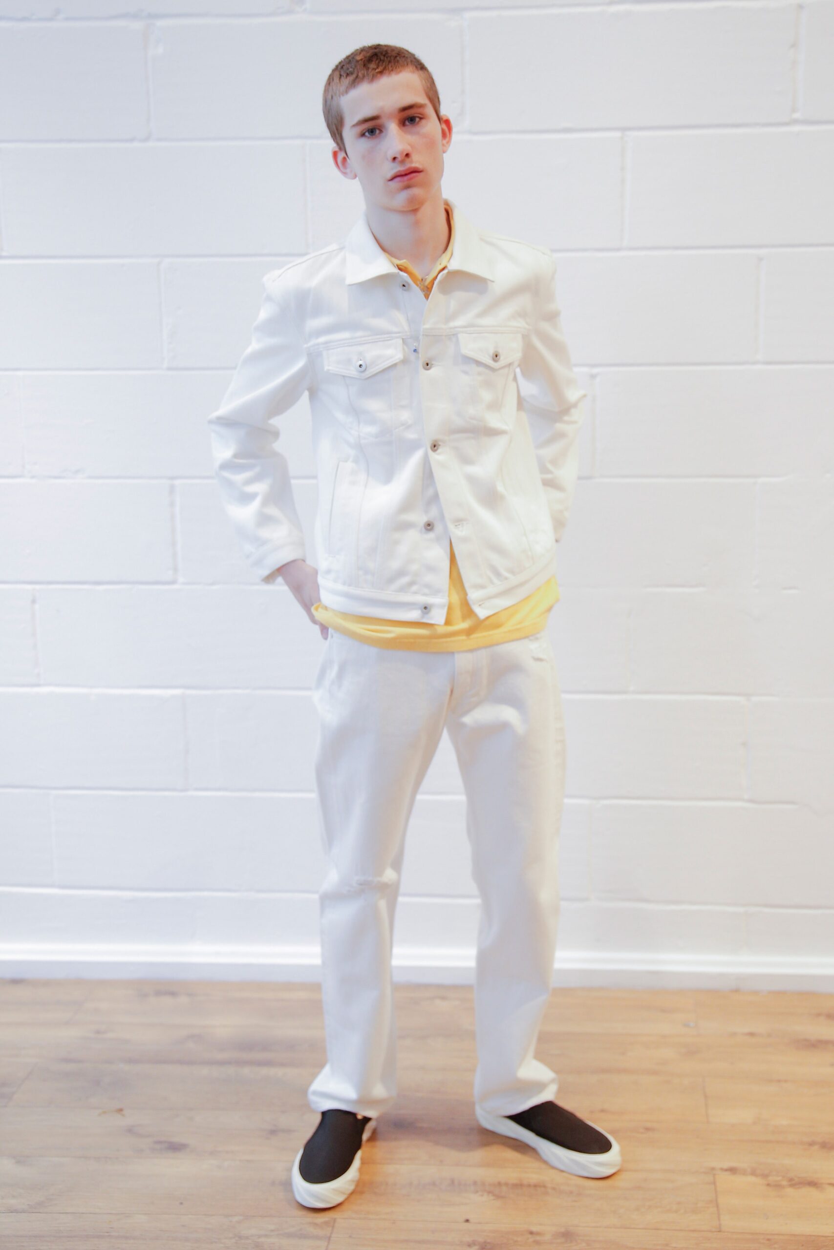white denim jacket with yellow shirt
