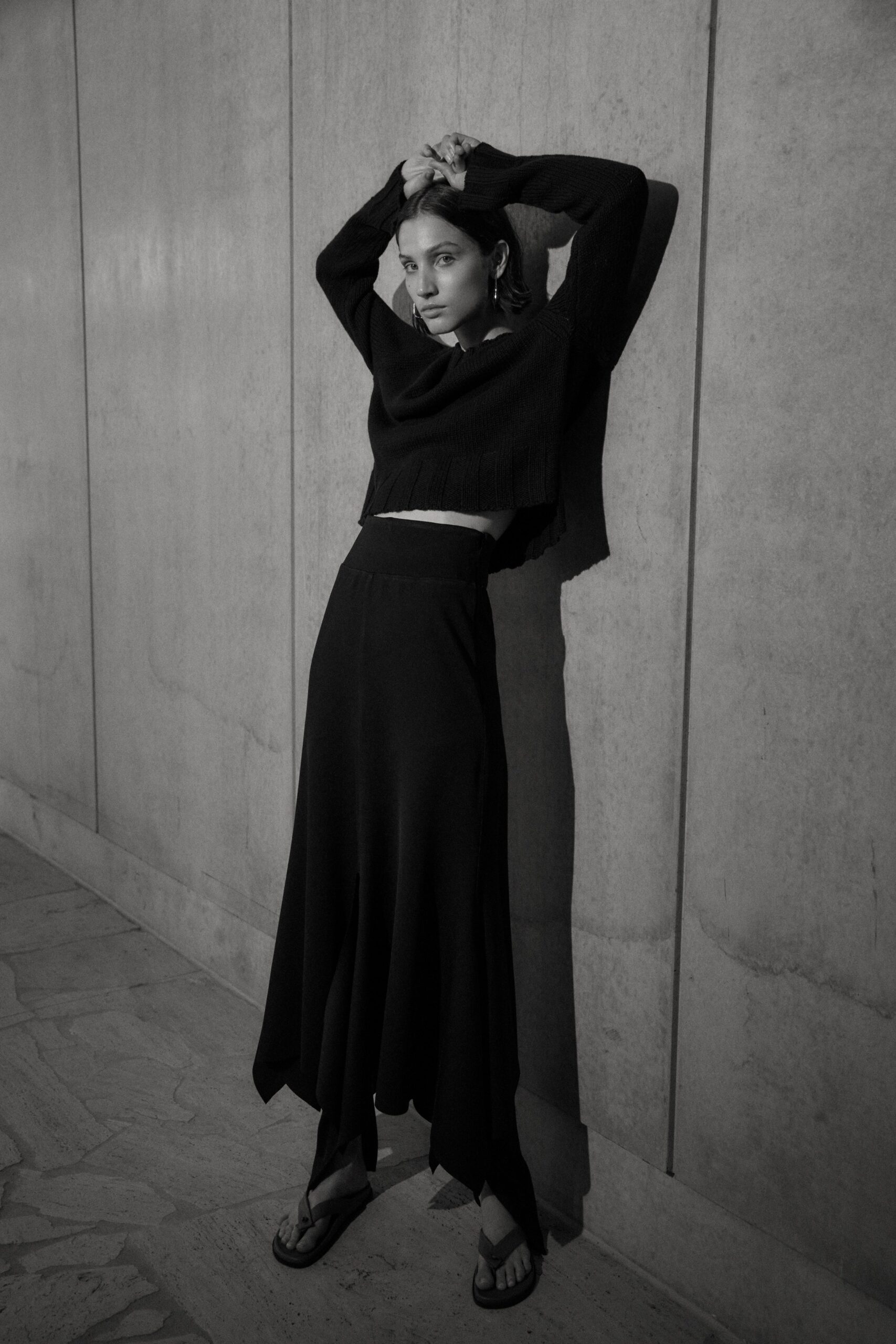 black fitted top and asymmetric skirt