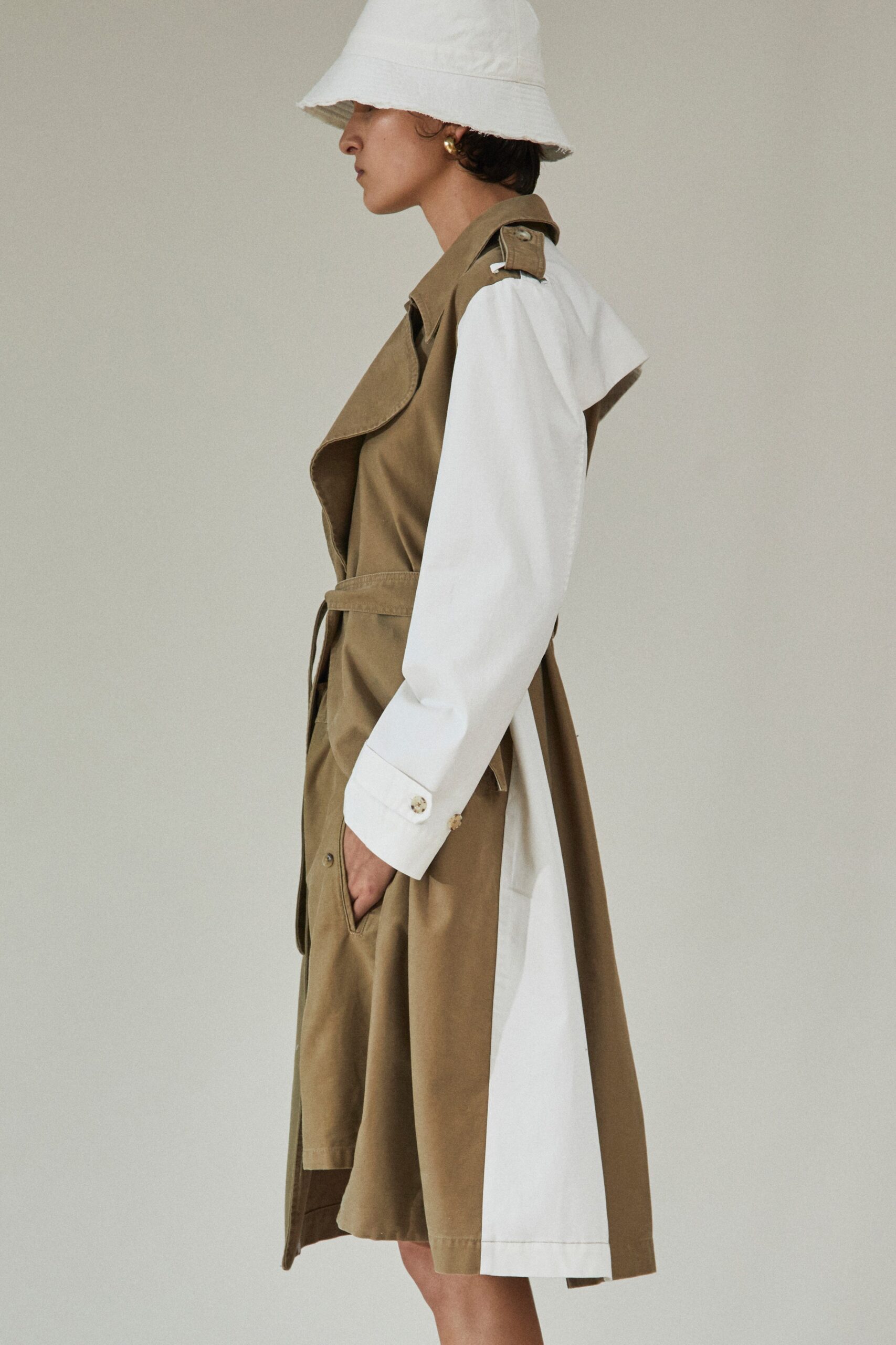 brown and white belted trench coat