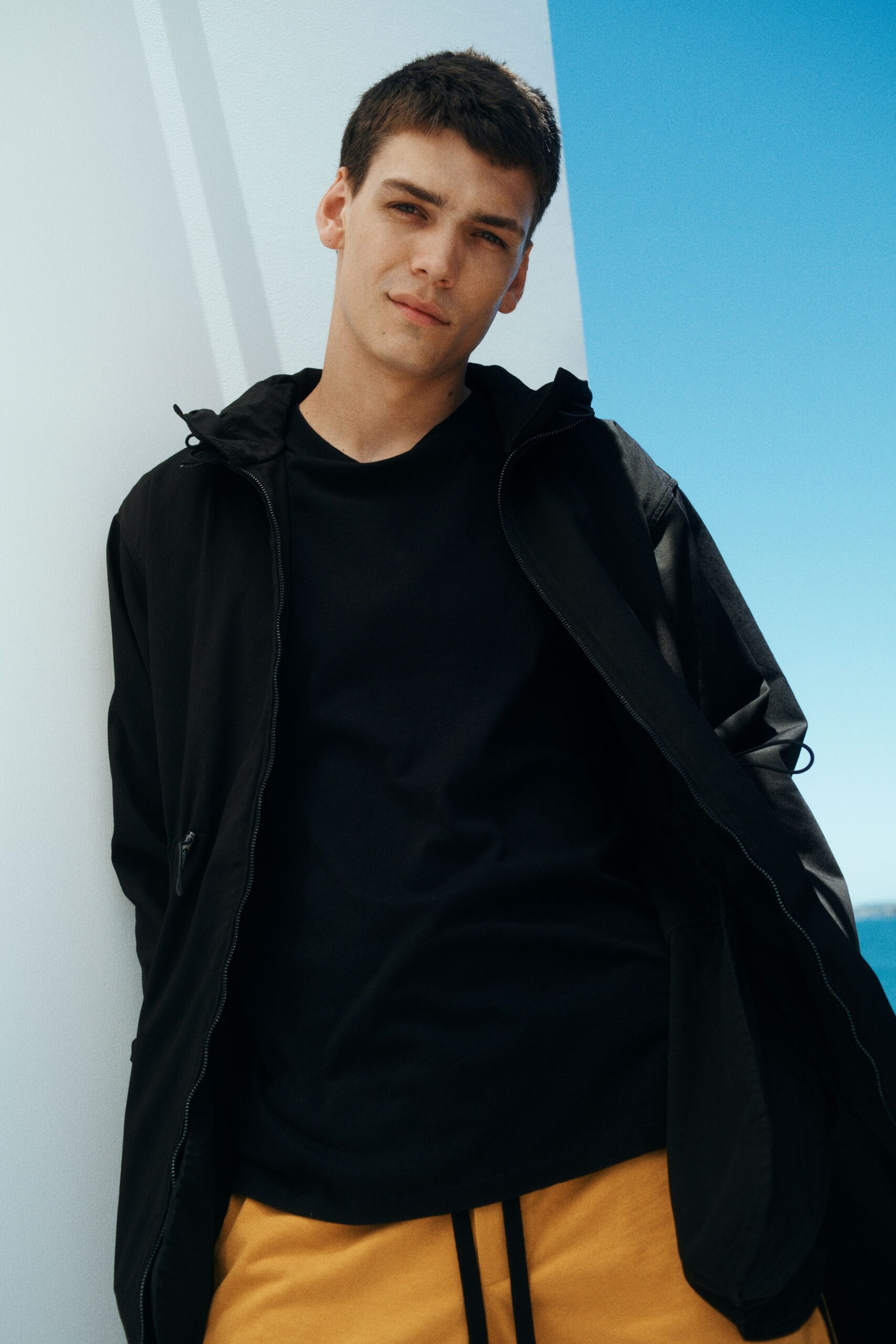 black jacket with yellow pants