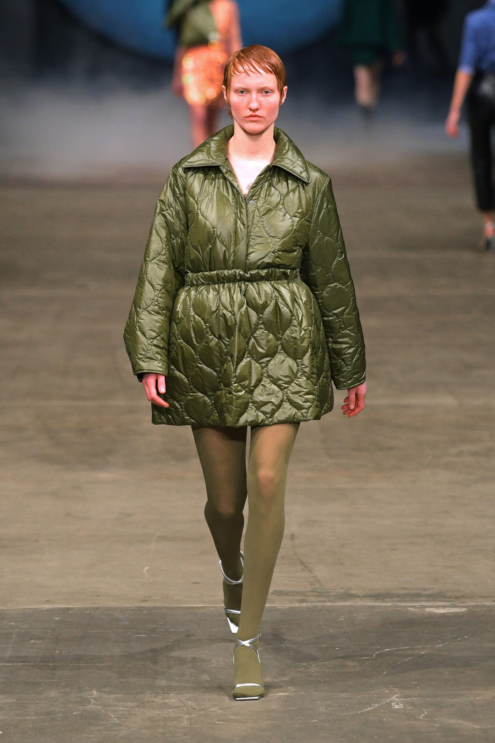 green quilted coat with silver shoes