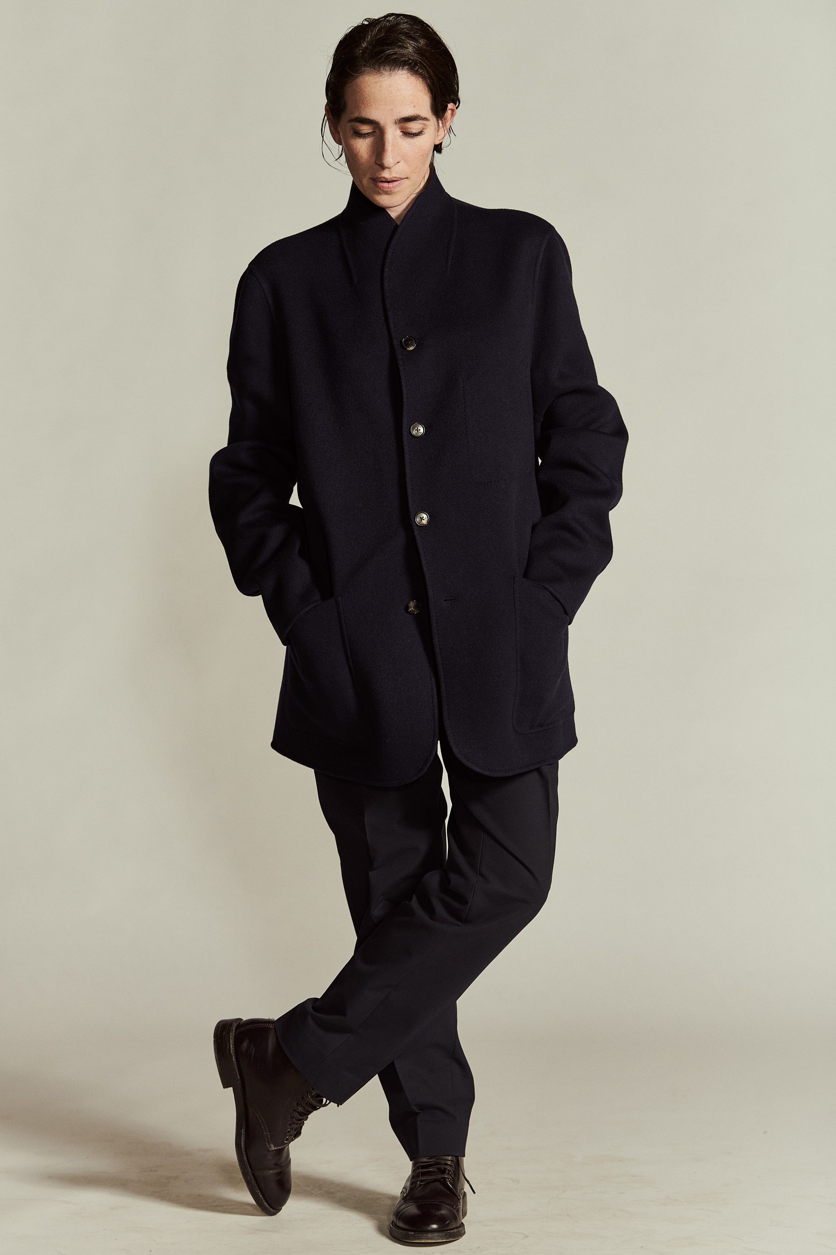 black wool coat and tailored pants