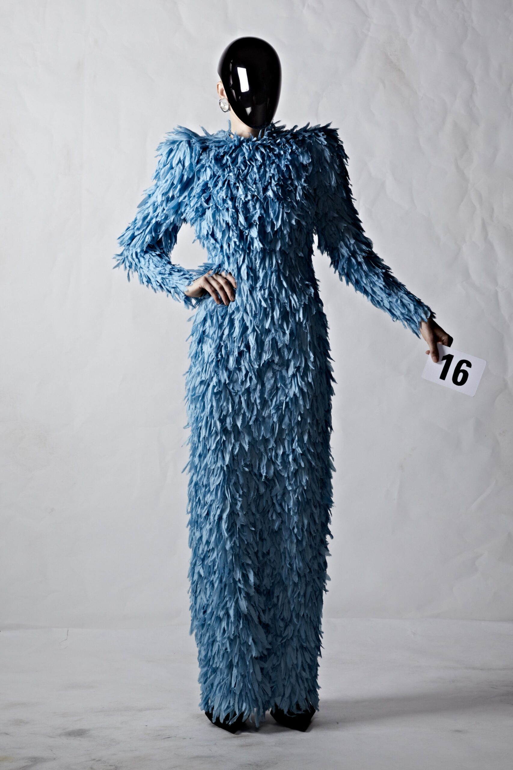 blue feathered long-sleeve gown