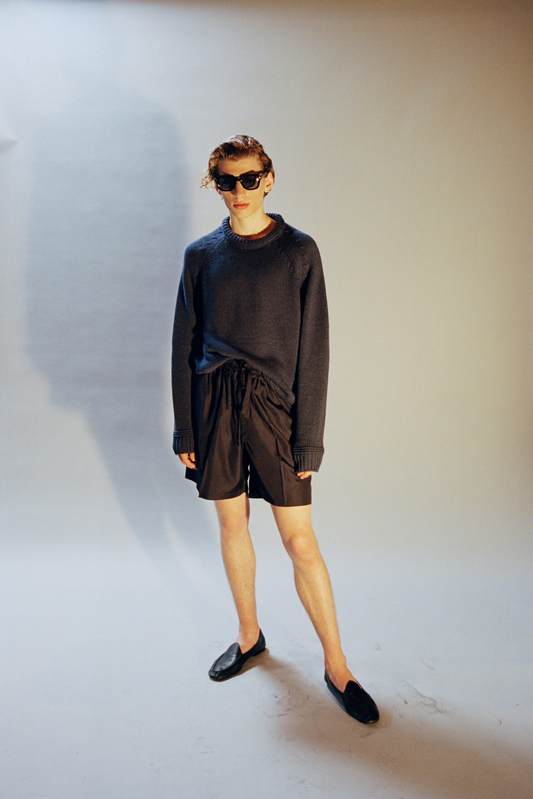 gray relaxed sweater with black shorts