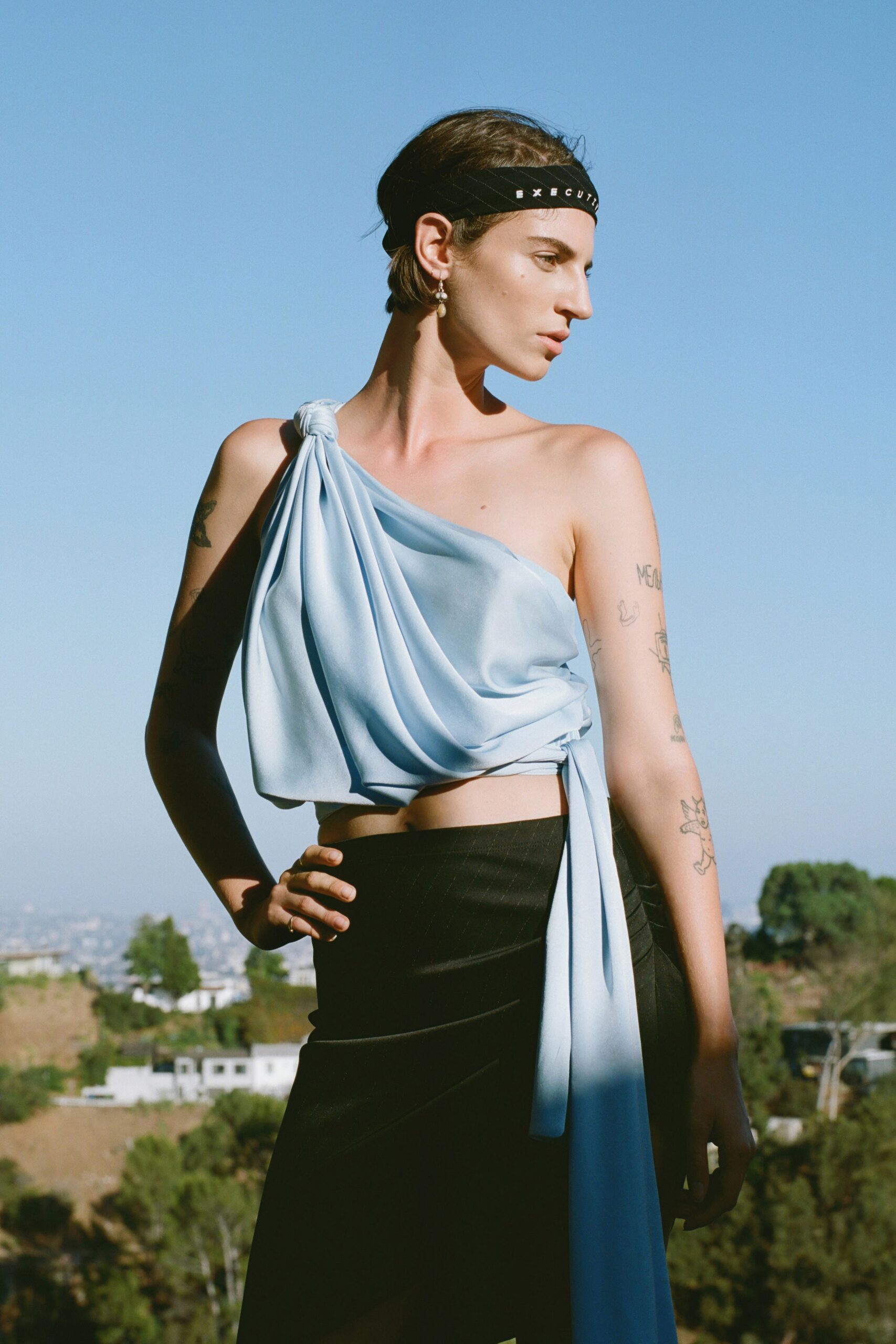 blue silk halter top and black pencil skirt
