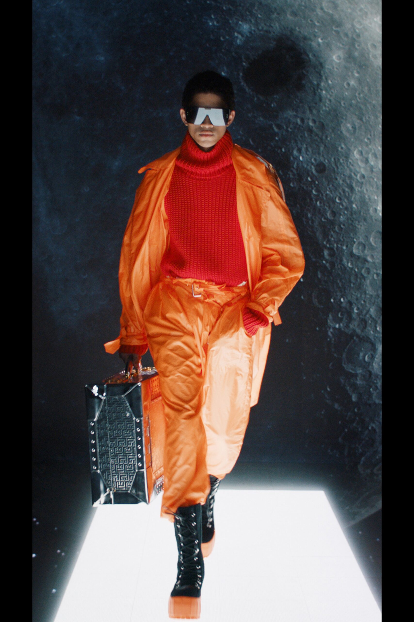 orange vinyl coat with red sweater