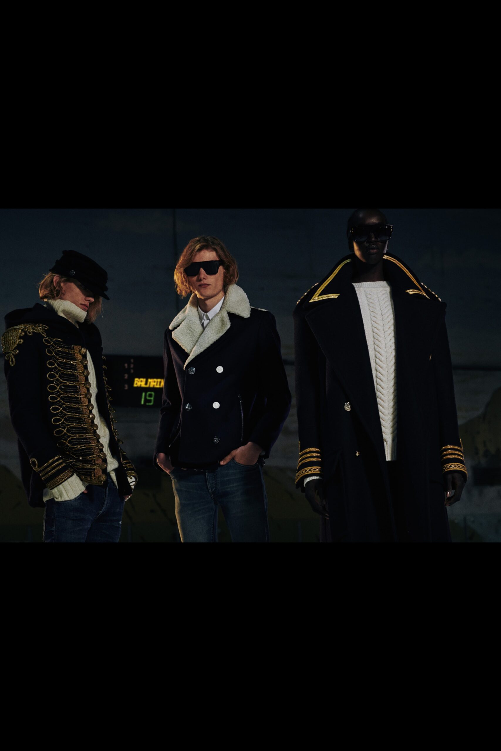 black coat, navy jacket, white sweater