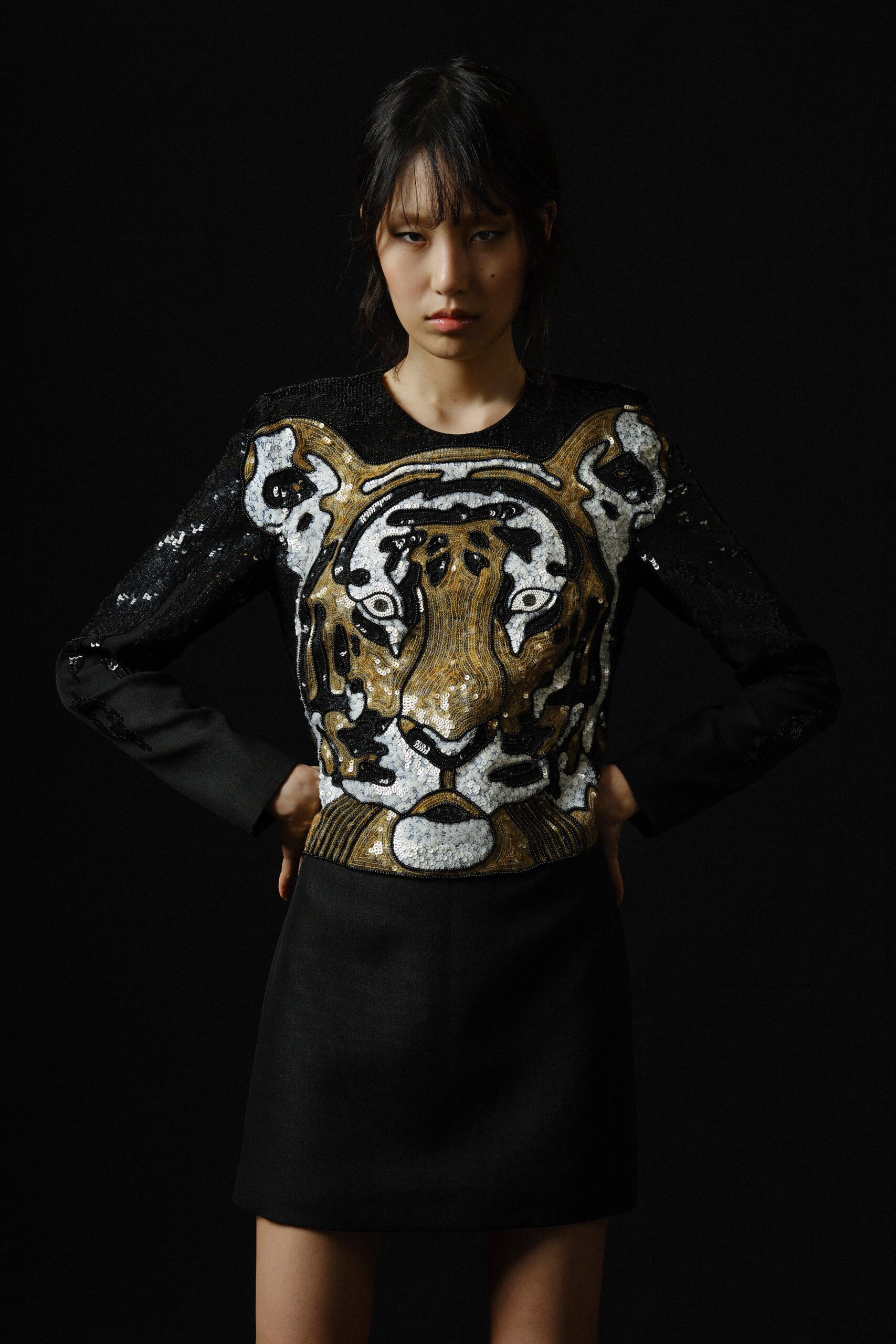 black sequin embroidered top and mini skirt