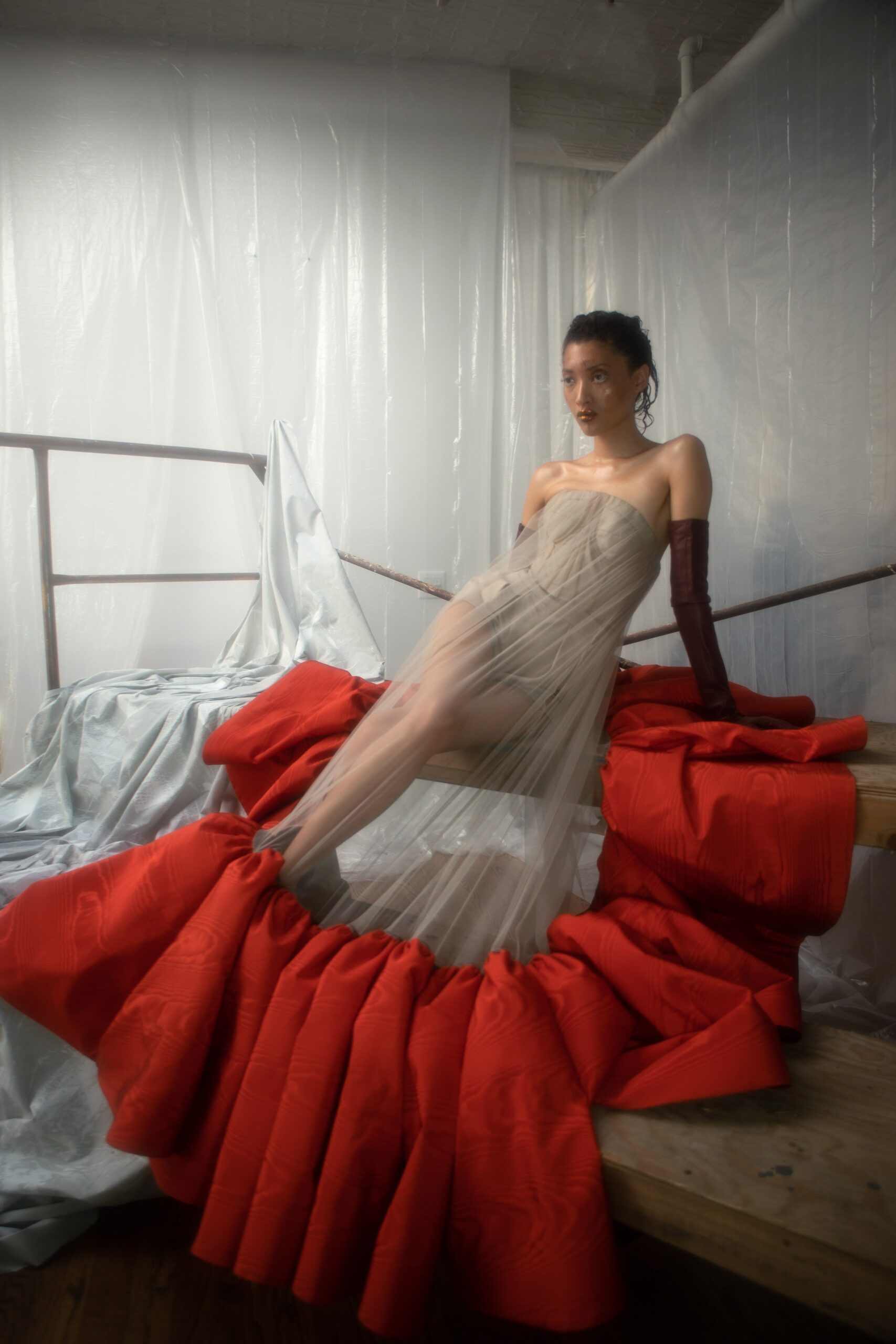red silk strapless fitted pleated layered sheer dress