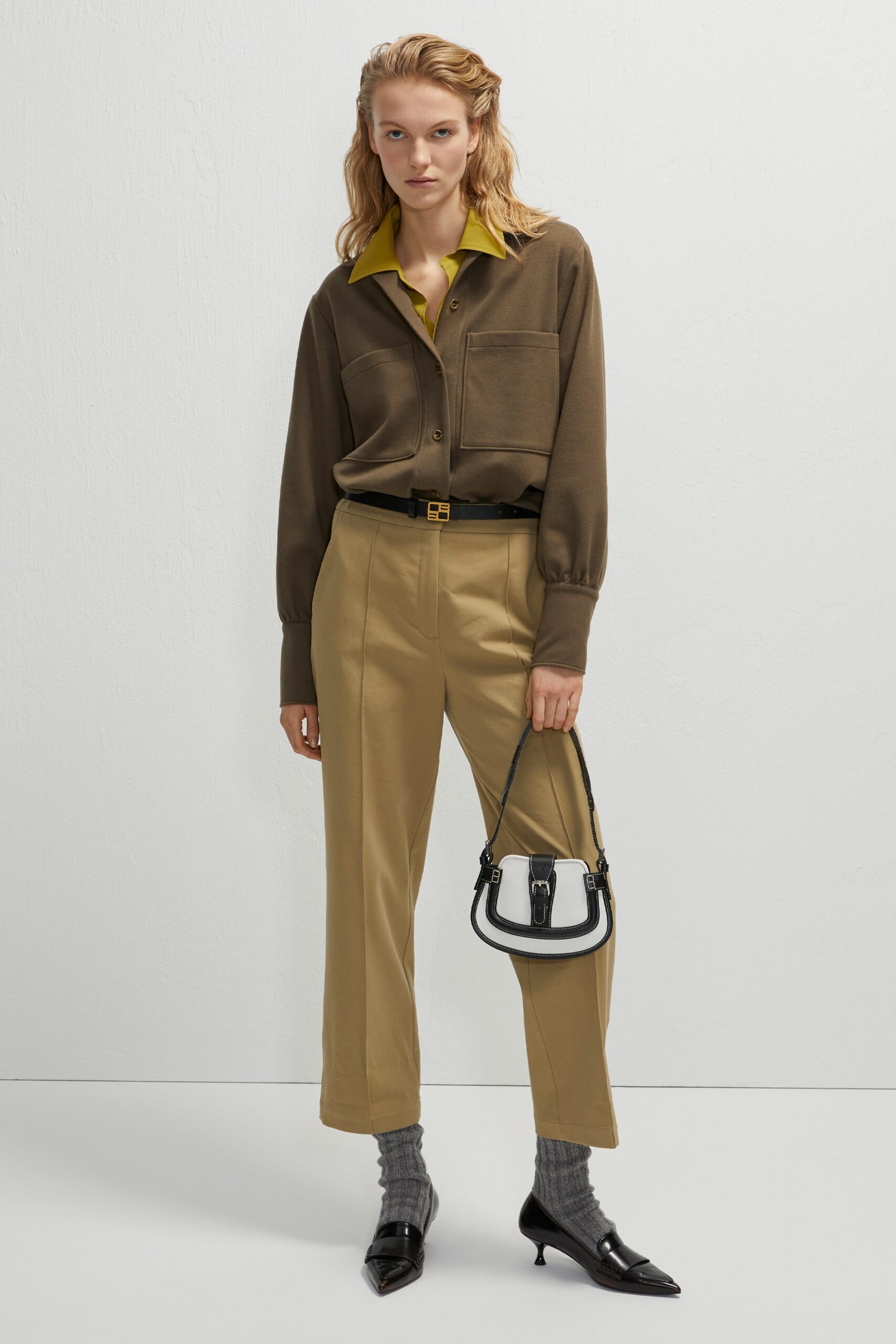 brown shirt with beige pants