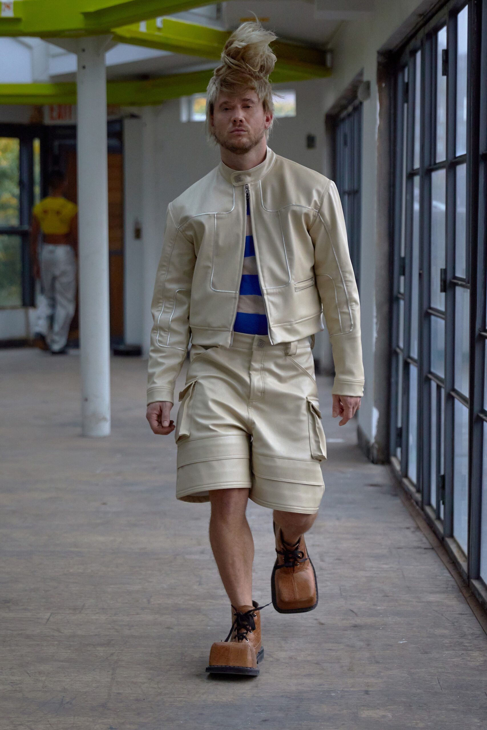 beige leather jacket and cargo shorts