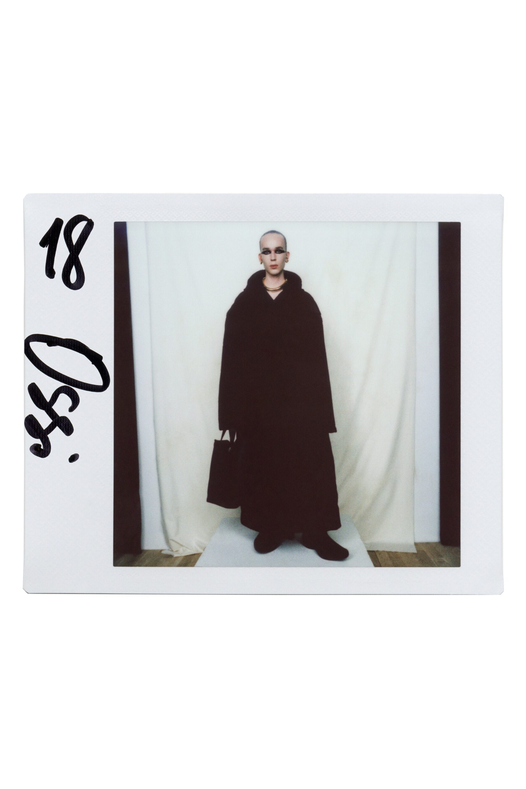 black wool long-sleeve collared oversized draped maxi cape