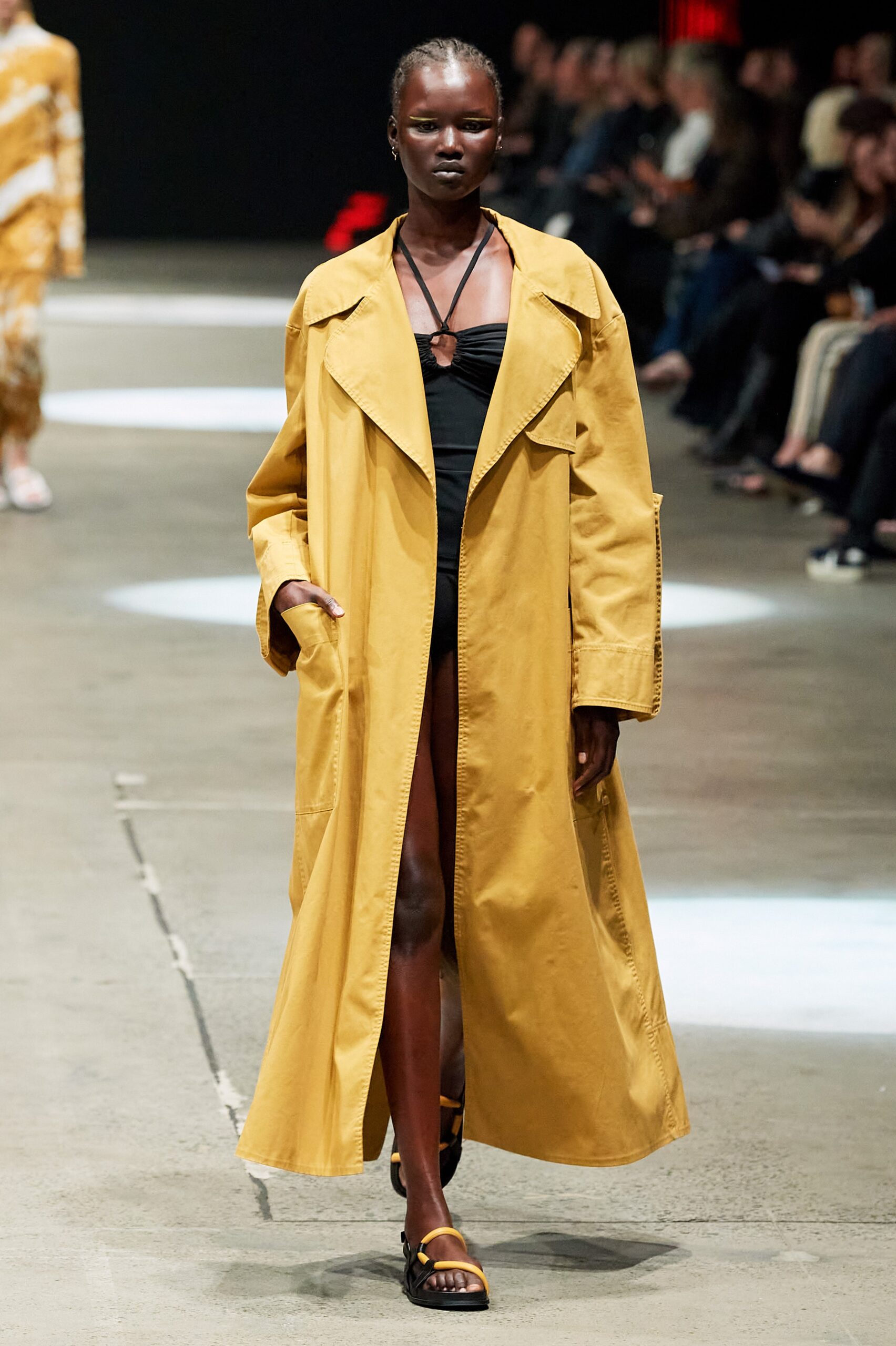 yellow coat black swimsuit