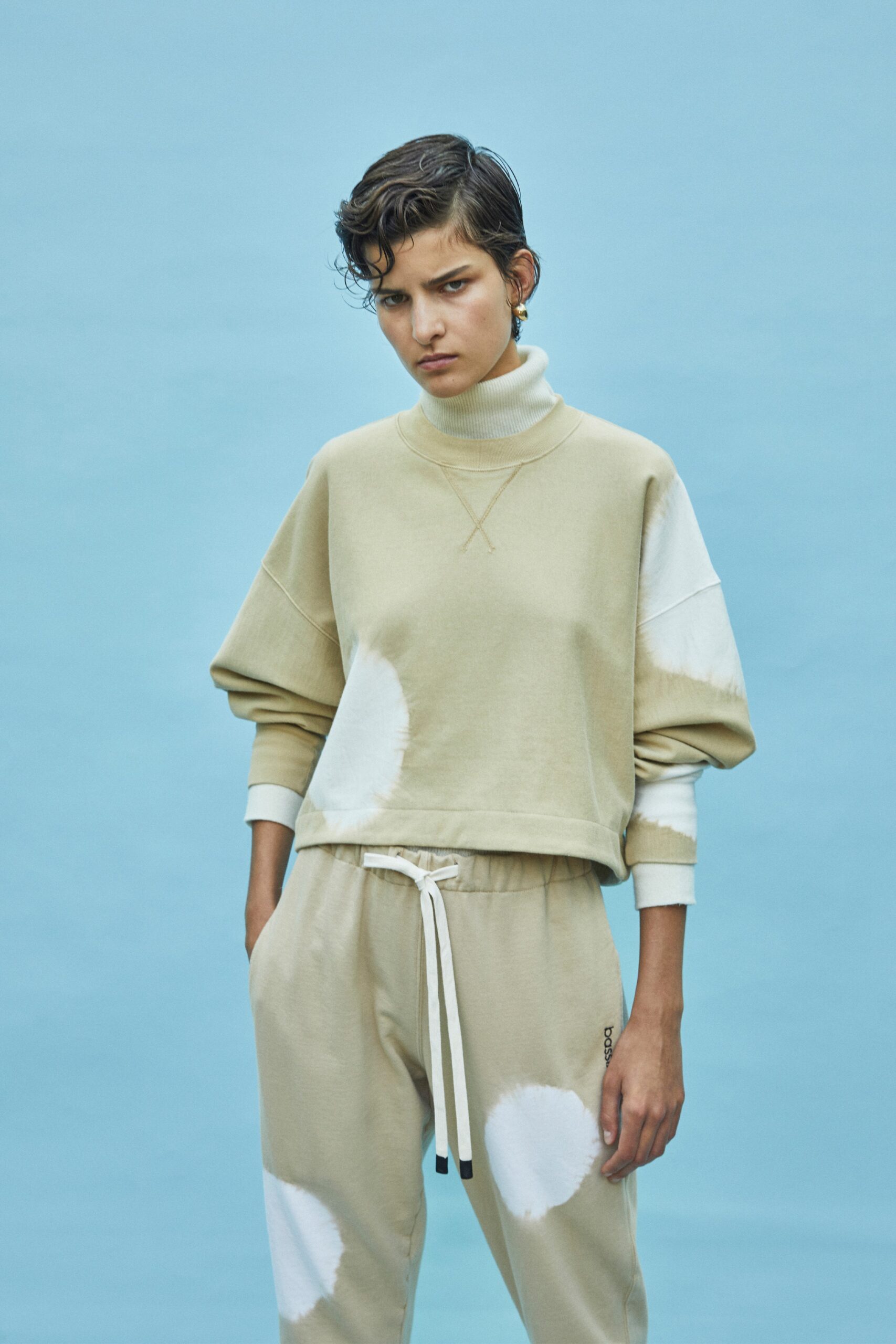 beige cotton long-sleeve high-neck relaxed draped sweater