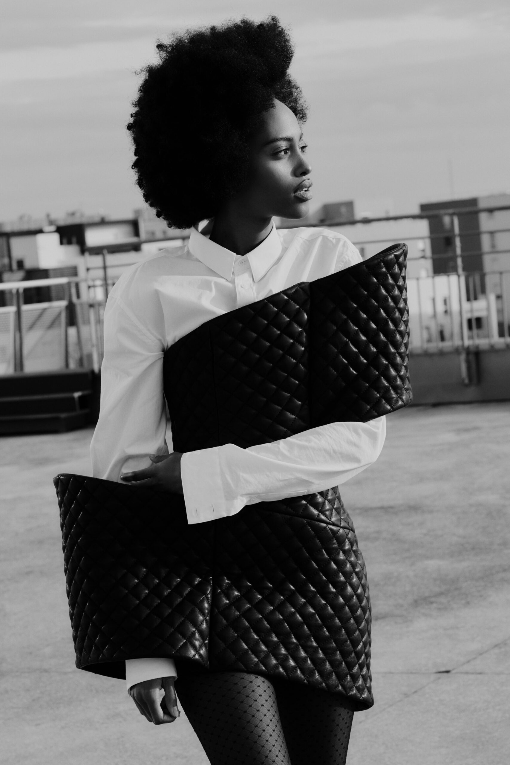 white fitted blouse and black quilted skirt