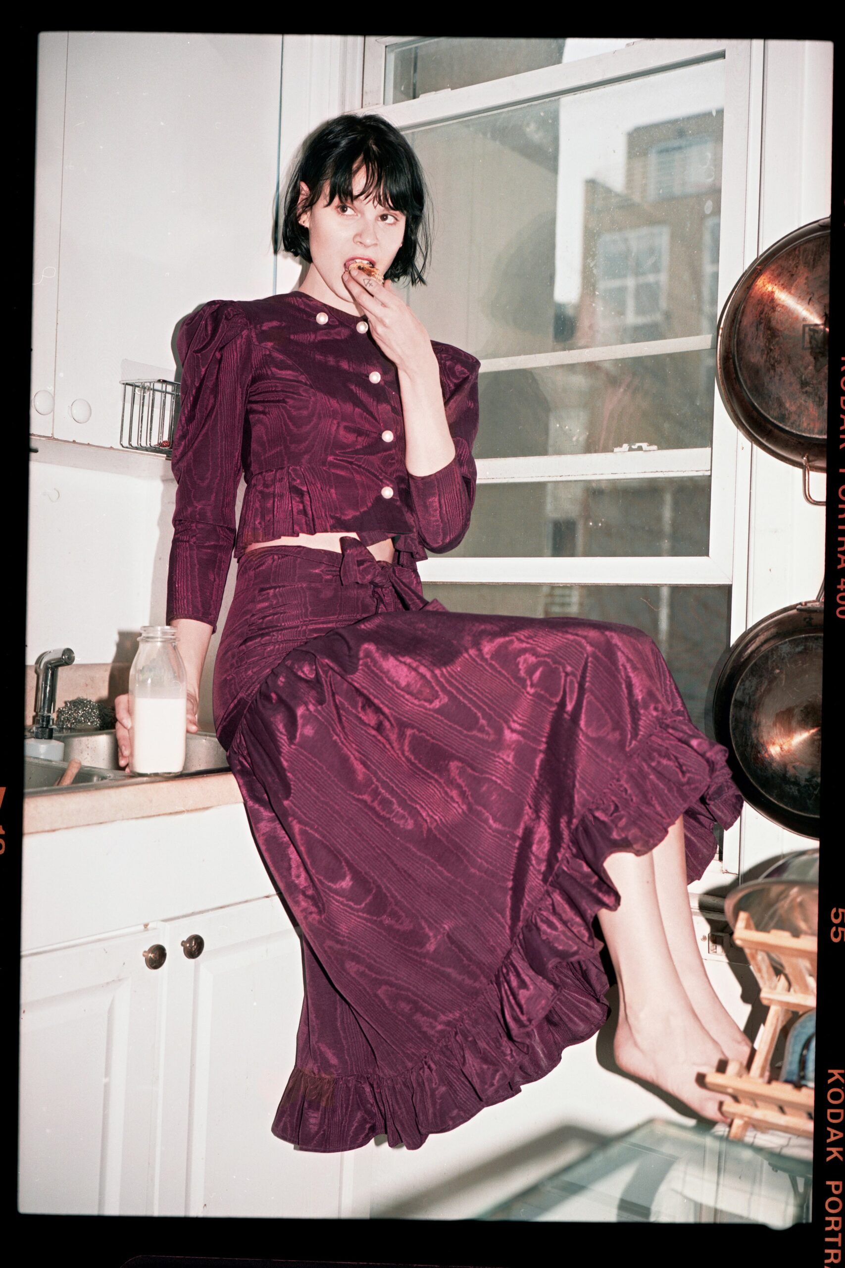 purple ruffled top and skirt